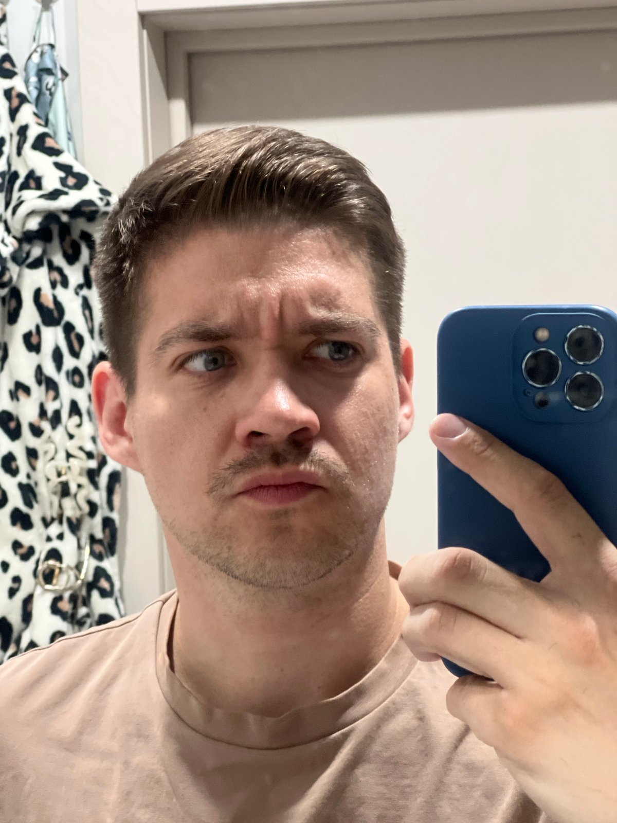 Man takes selfies in Kazan apartment setting