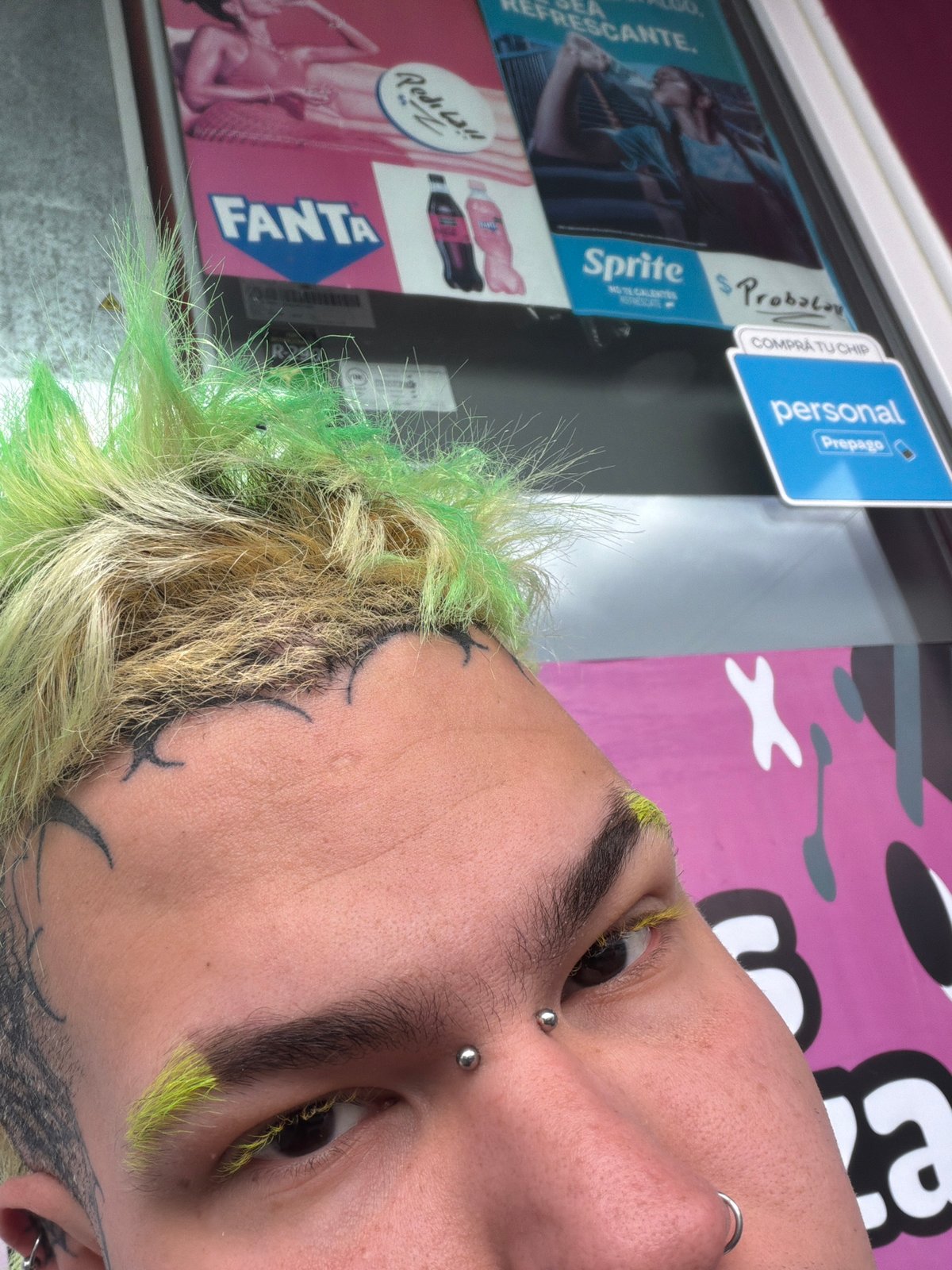 Green-haired person spotted at Ushuaia beverage display