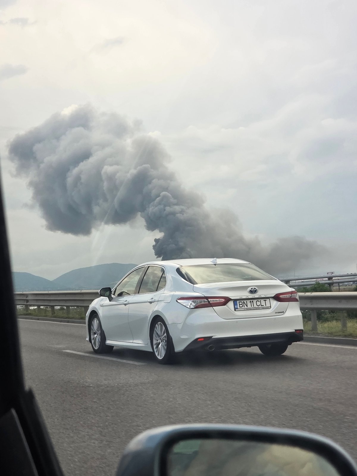 Dark smoke rises near highway outside Voluyak, Bulgaria