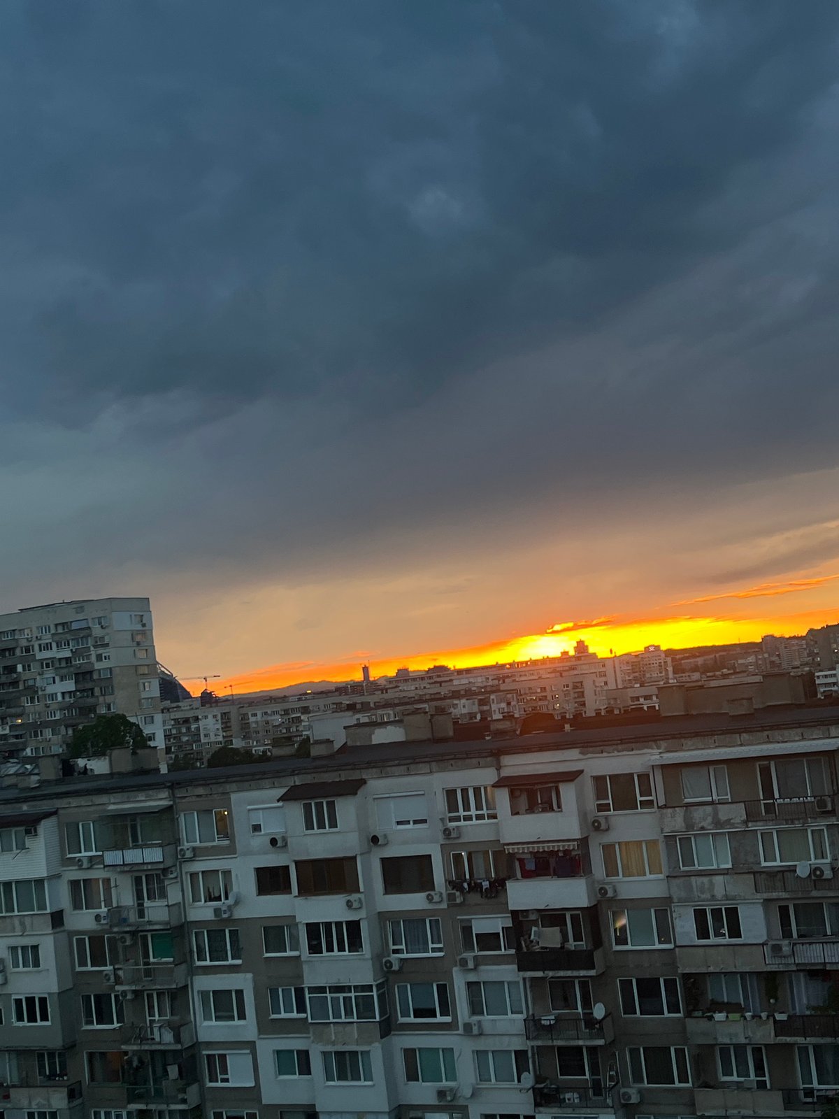 Sunset cityscape captured over Sofia apartment blocks