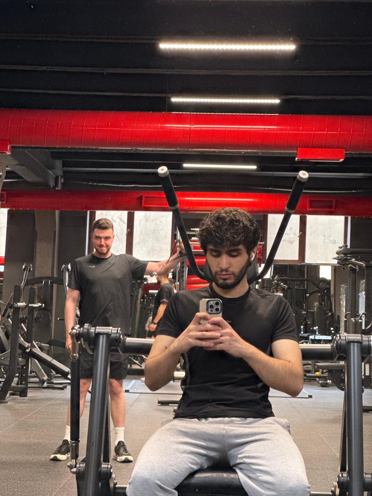 Morning gym session captured in Yerevan, man checks phone