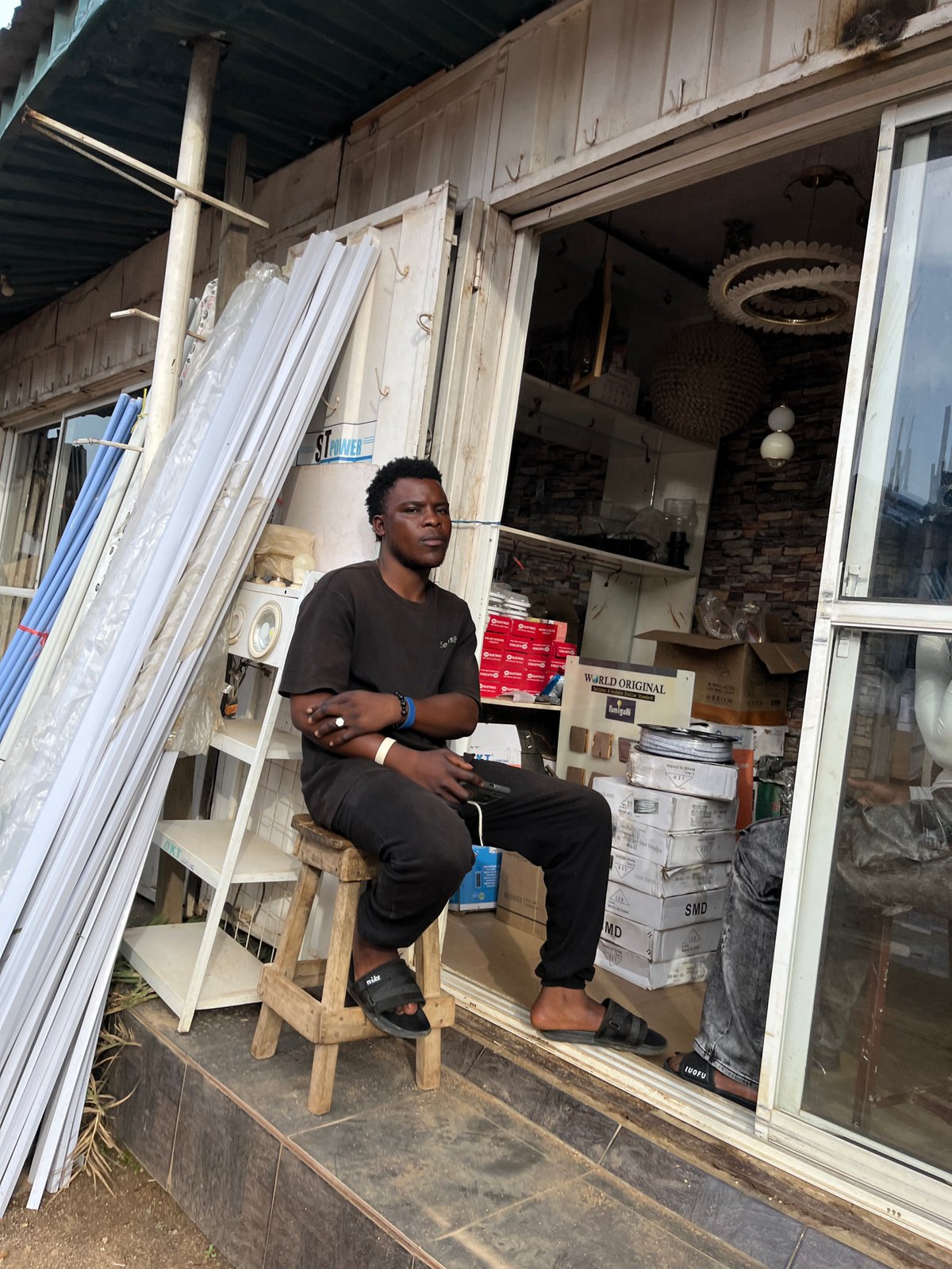 Everyday street life along a commercial strip in Gura Top, Nigeria