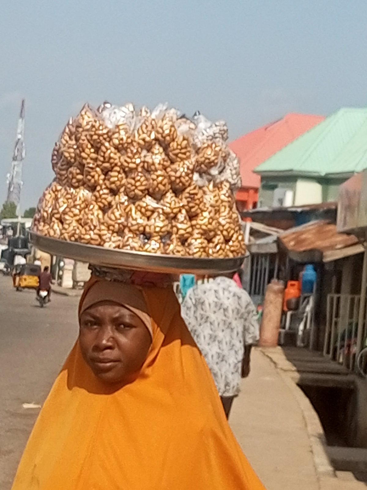 Midday street and market activity in Pantame, Nigeria