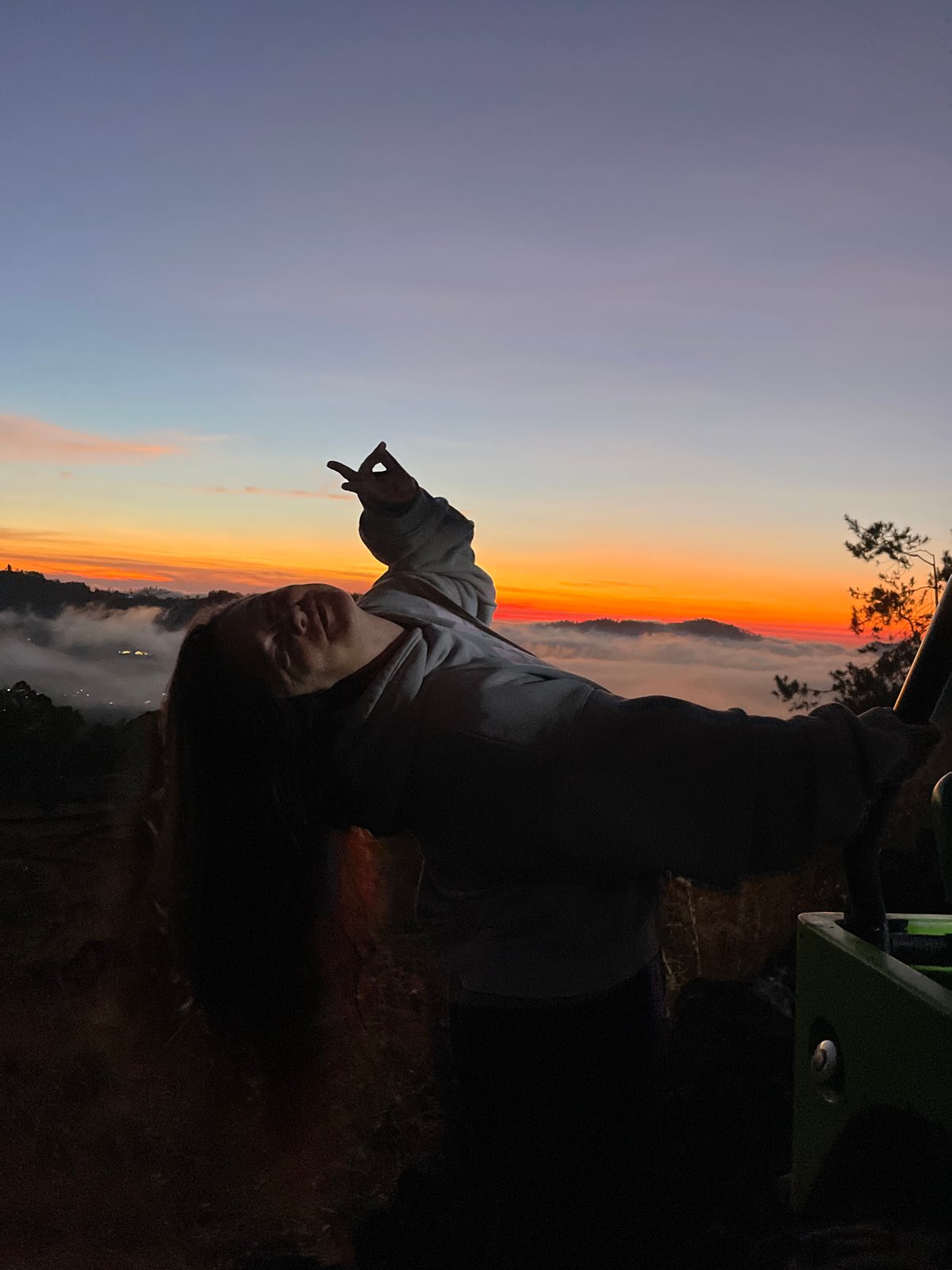 Dramatic silhouette pose on a Kintamani hilltop
