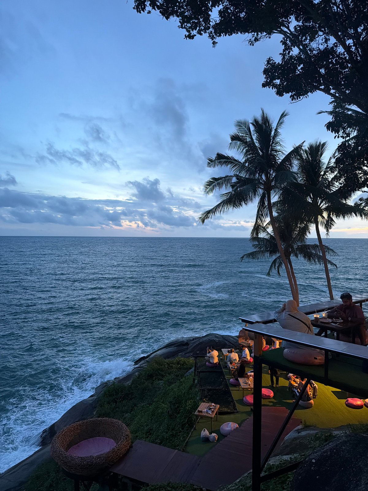 Dusk views from a clifftop bar over Patong's coastline.