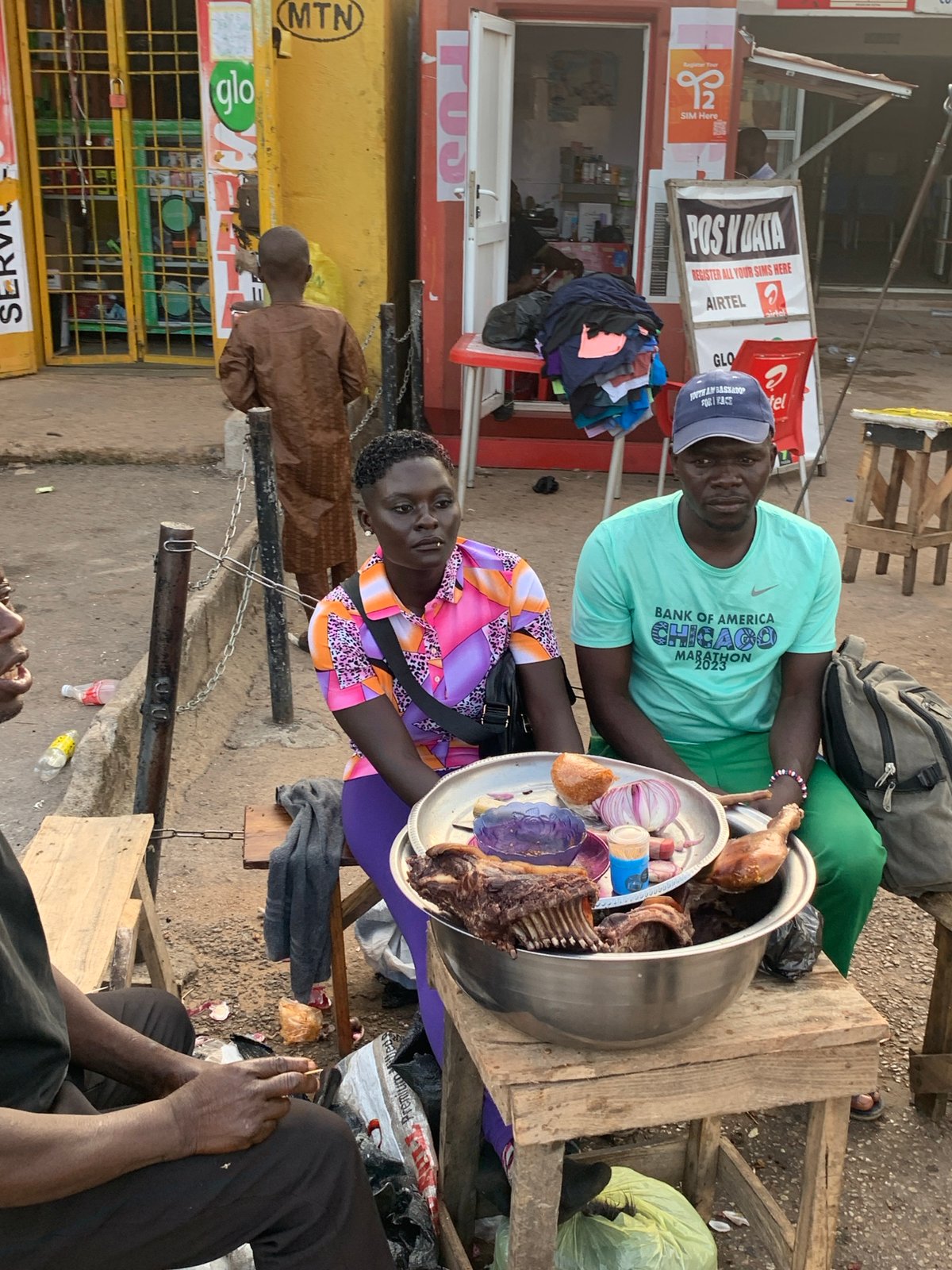 Everyday street life moving through Jos on a July afternoon