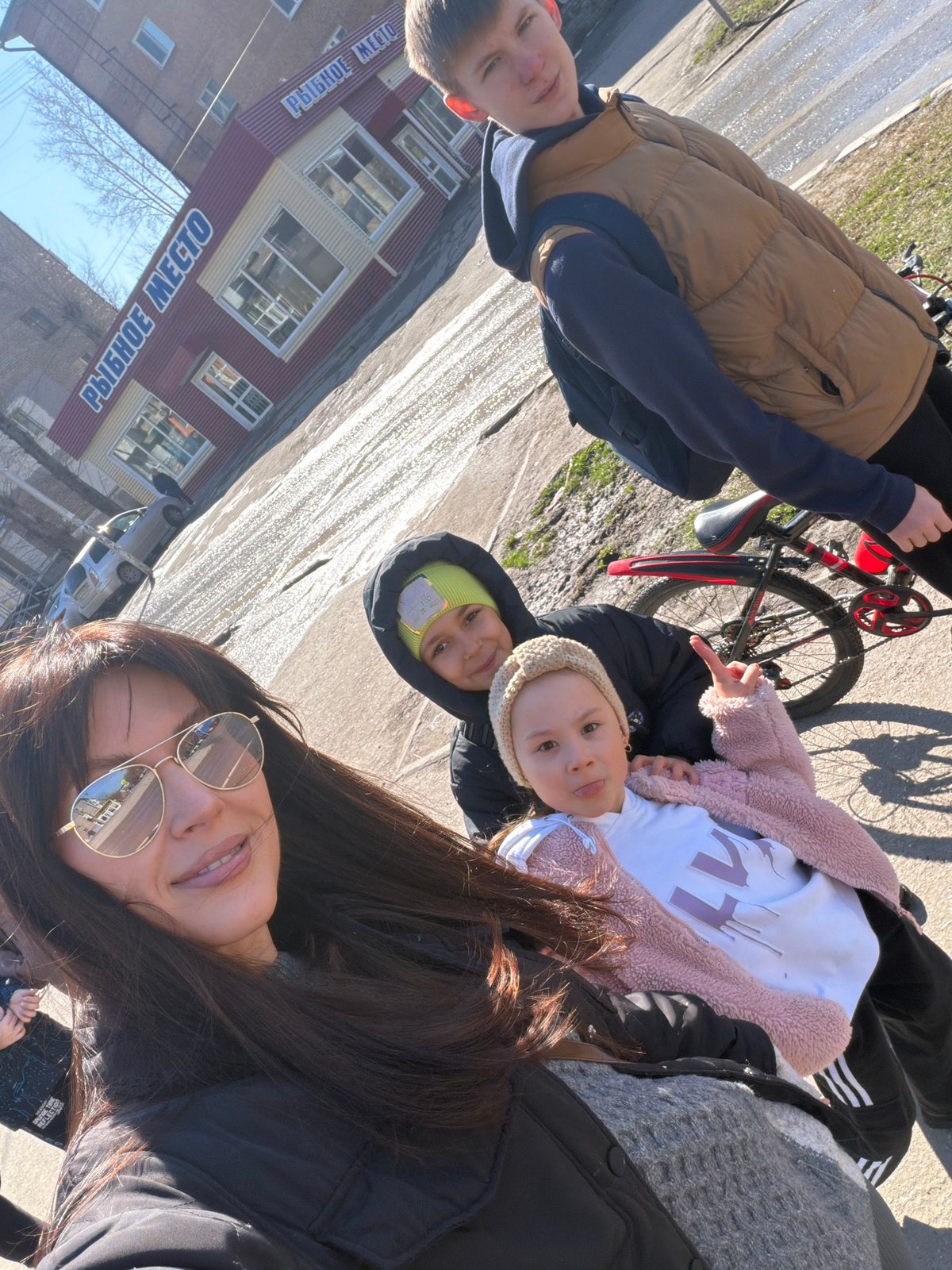 Family selfies captured during sunny morning in snowy Perm