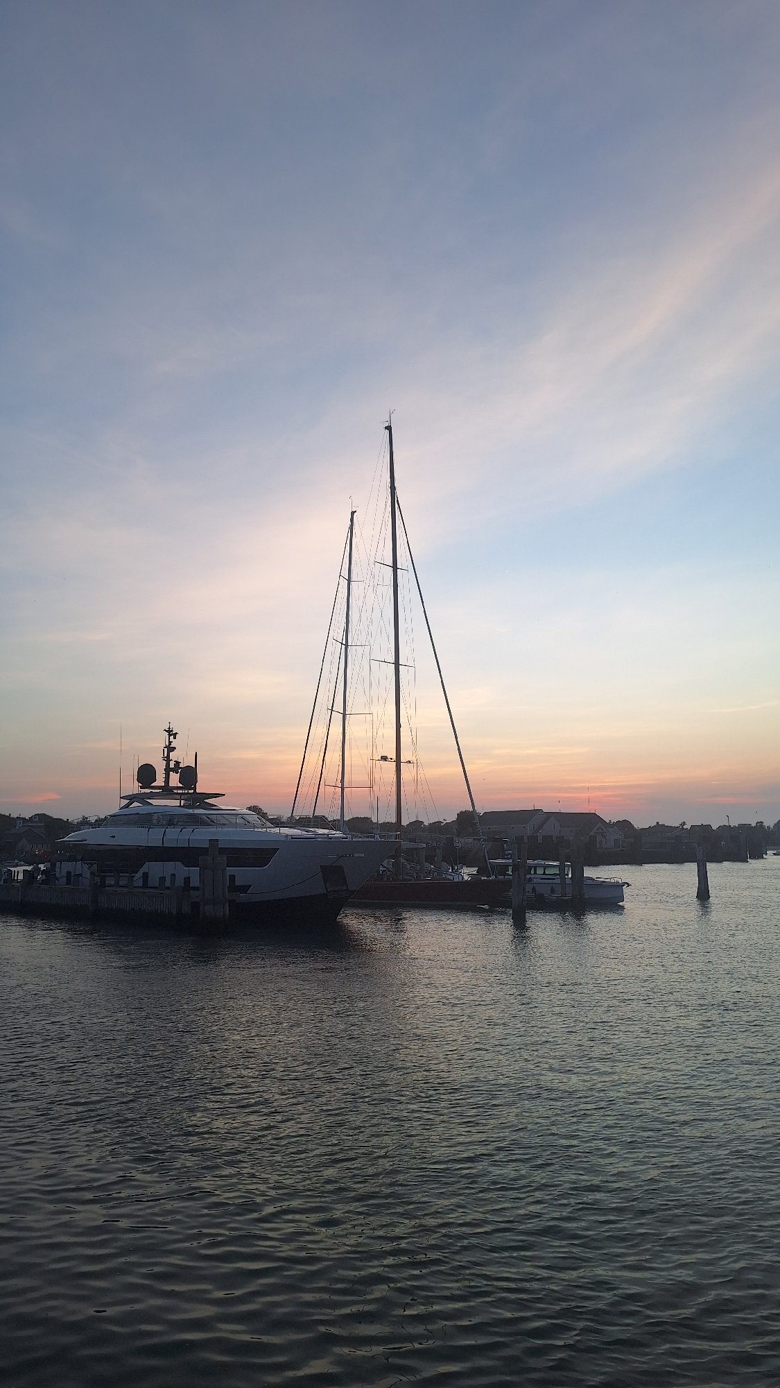 Yachts docked at Nantucket Harbor at dusk