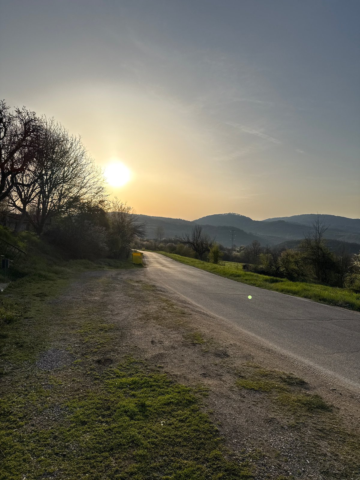 Rural roadside stop documented during sunset in Bulgarian countryside