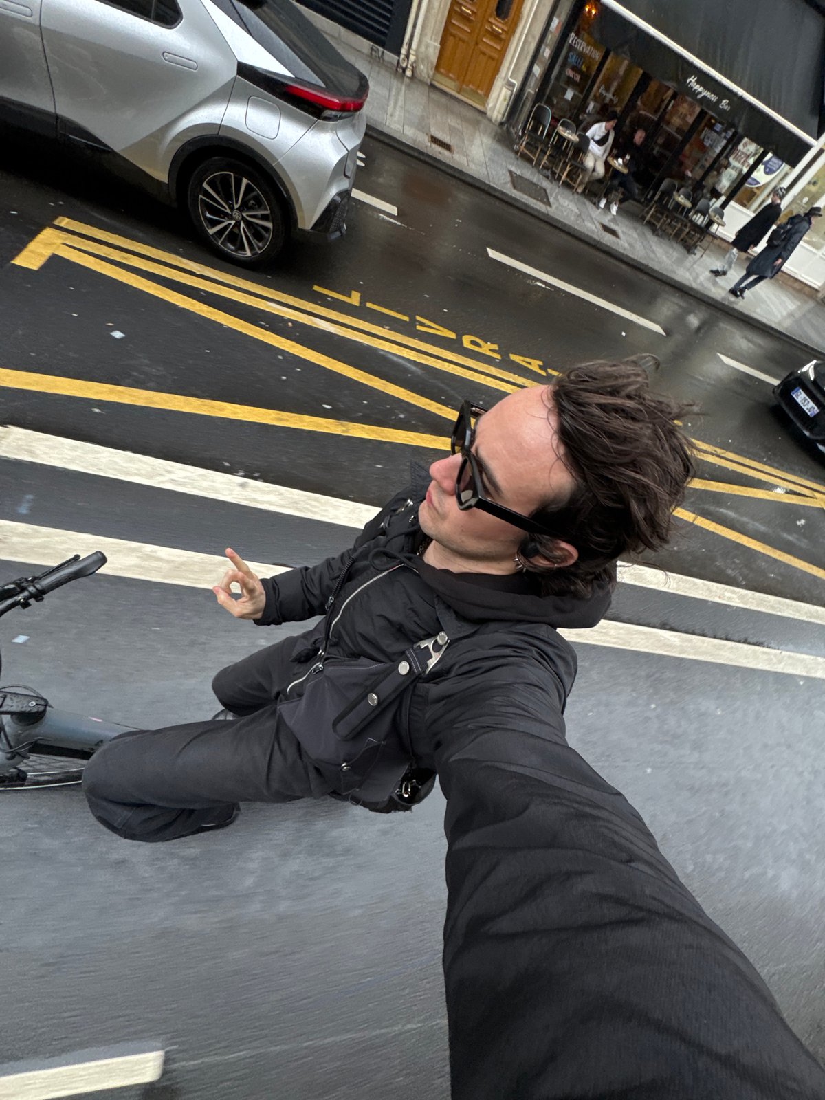 Cyclist rides designated bike lane in Paris