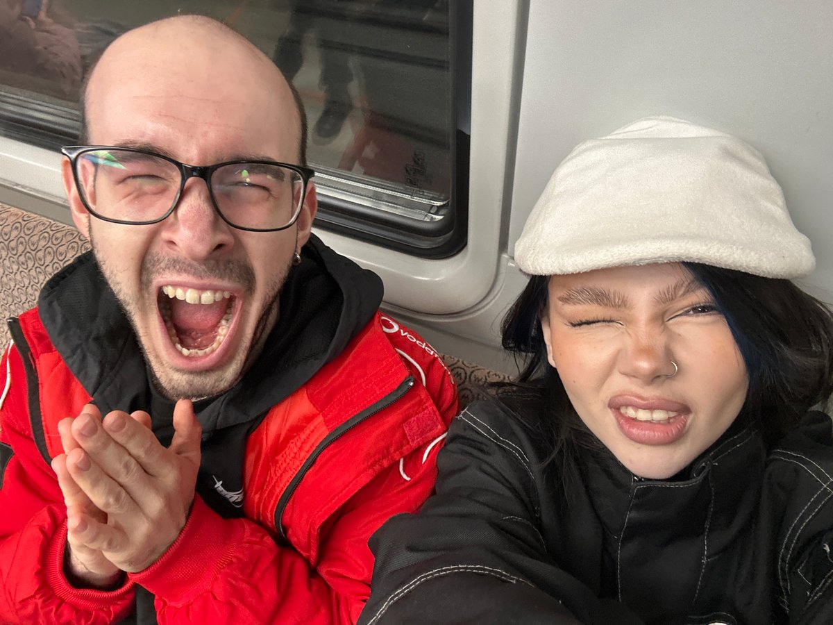 Two people take selfie on Moscow subway train
