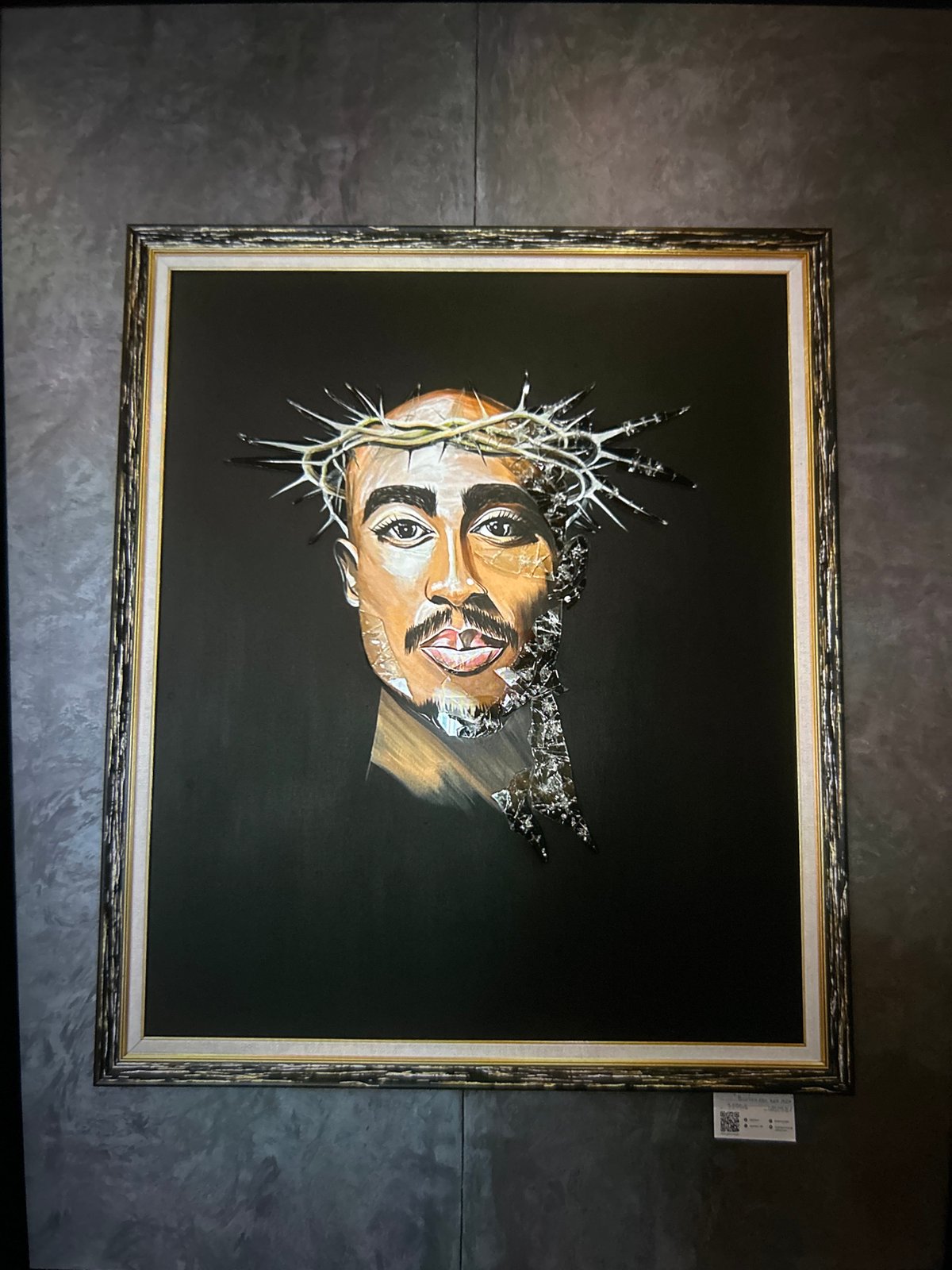 Tupac portrait and stormy street scene documented at unknown location