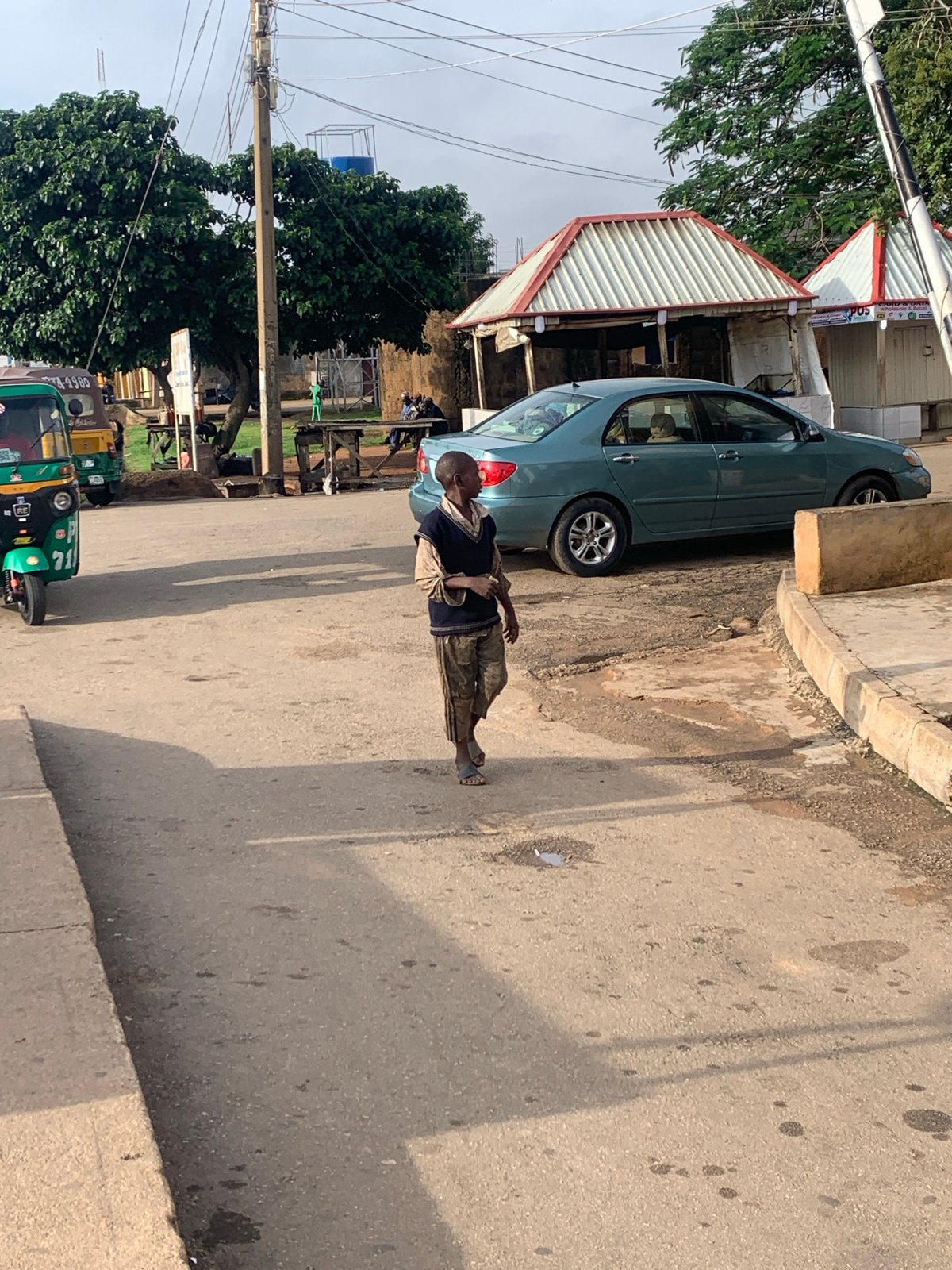 Morning street life around Jos, Nigeria's auto-rickshaw routes