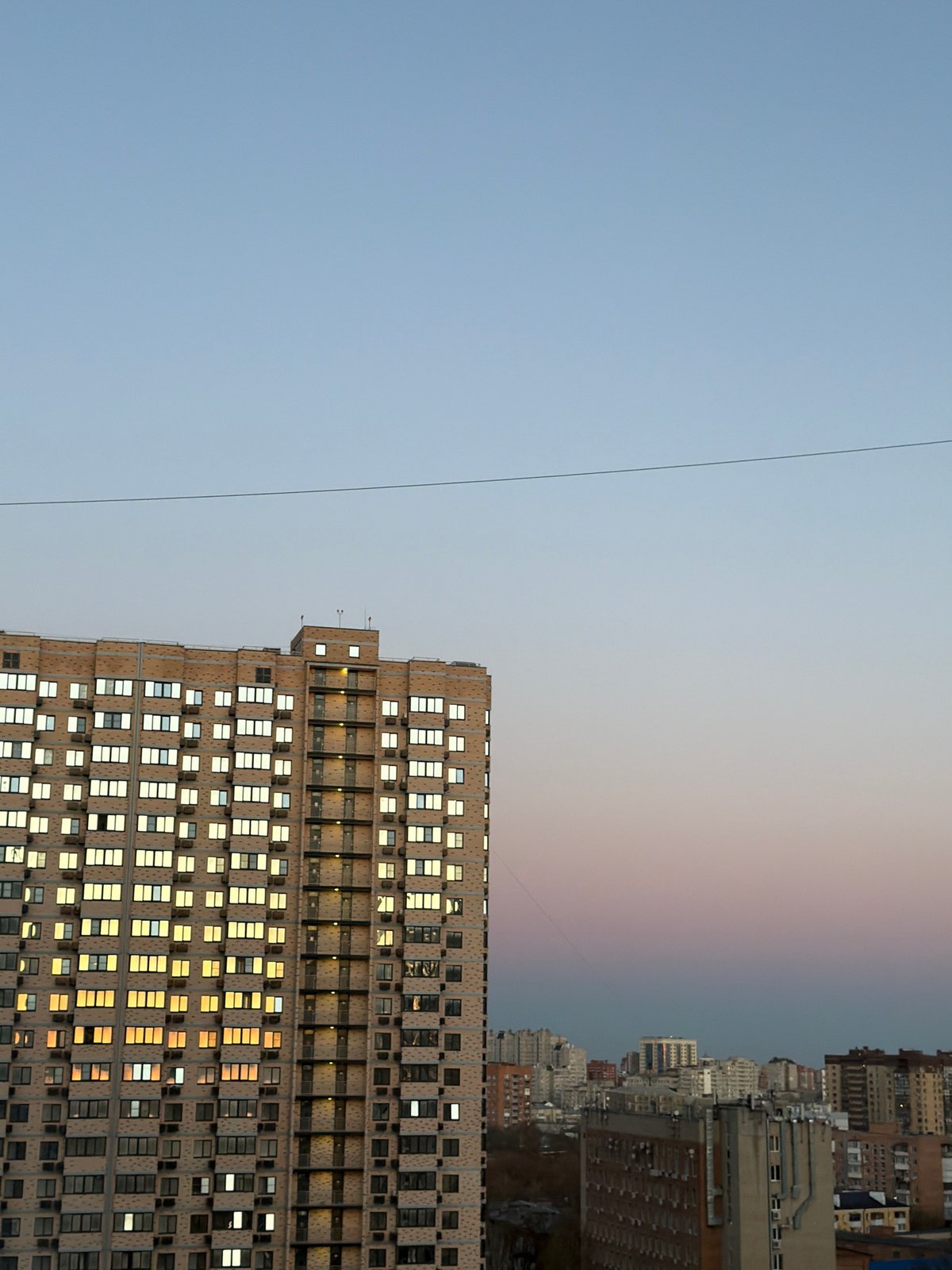 High-rise building photographed at dusk in Rostov-on-Don