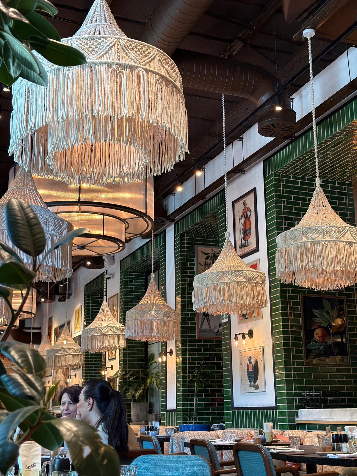 Eclectic Baku restaurant with macrame lamps and folk-style decor