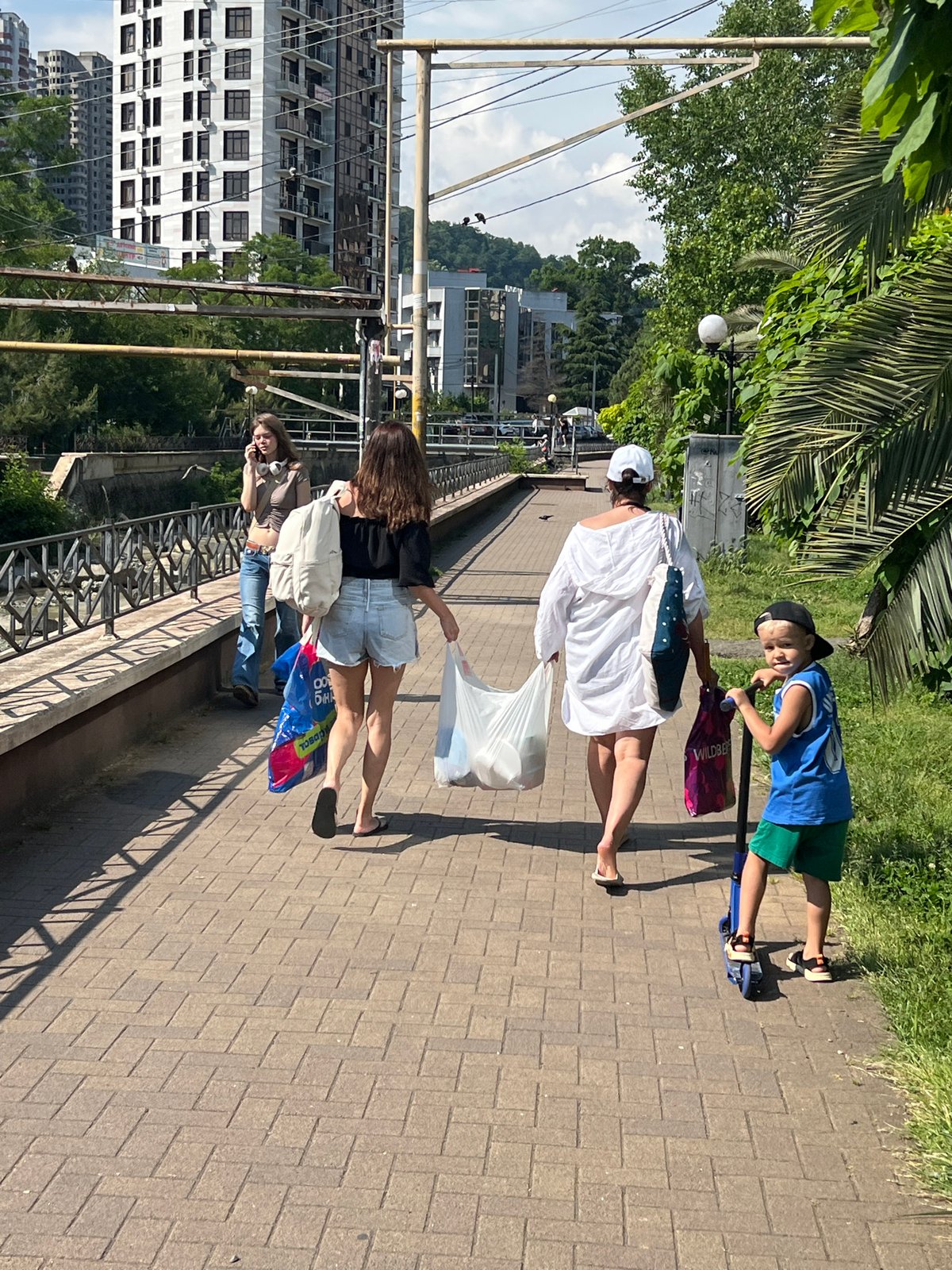 Summer afternoon life unfolds across Sochi's streets and beaches