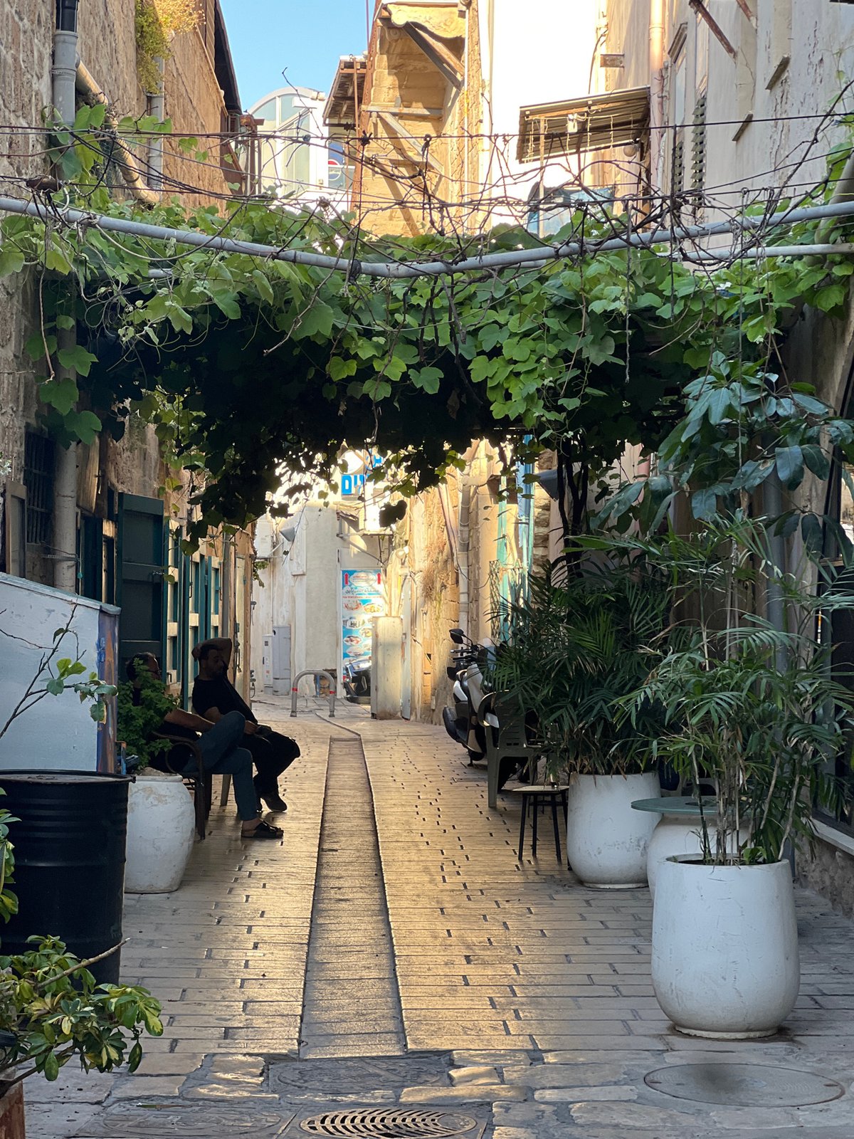 Tourist documents walking tour through historic Old City Acre