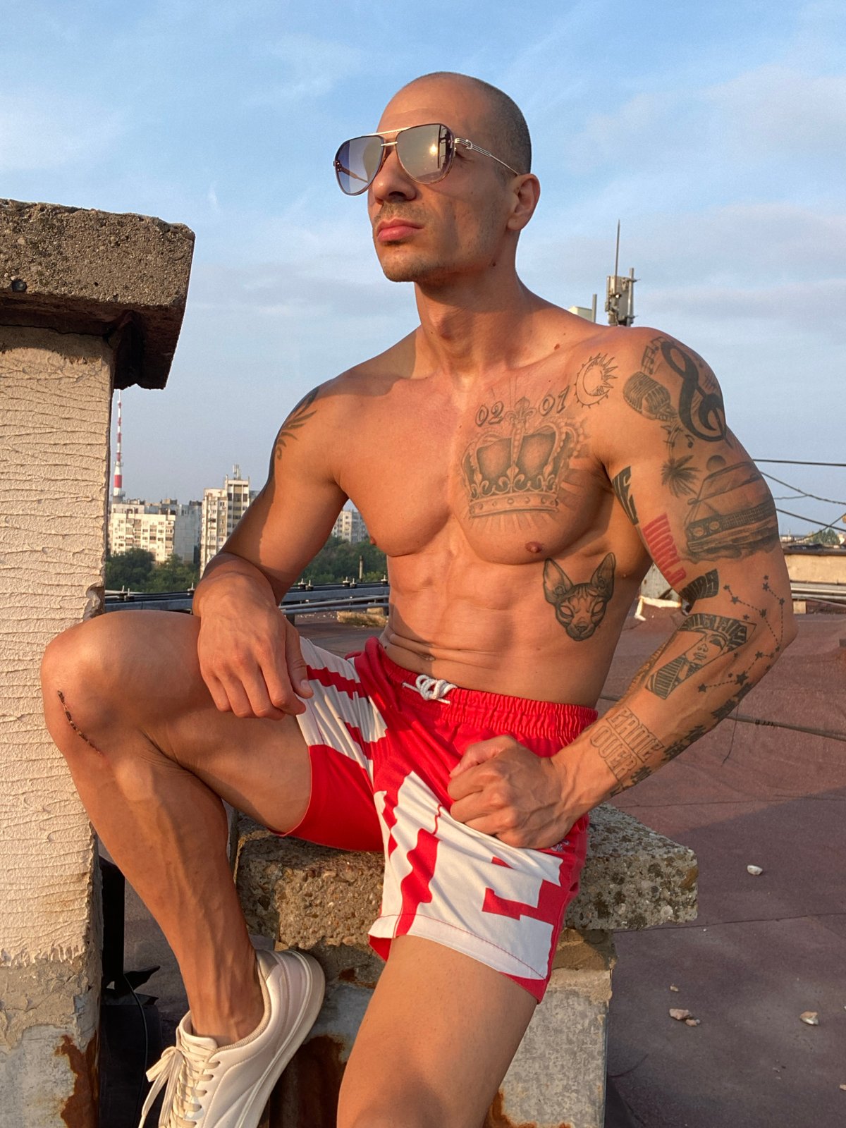 Tattooed figure and telecom cables at dusk in Pleven