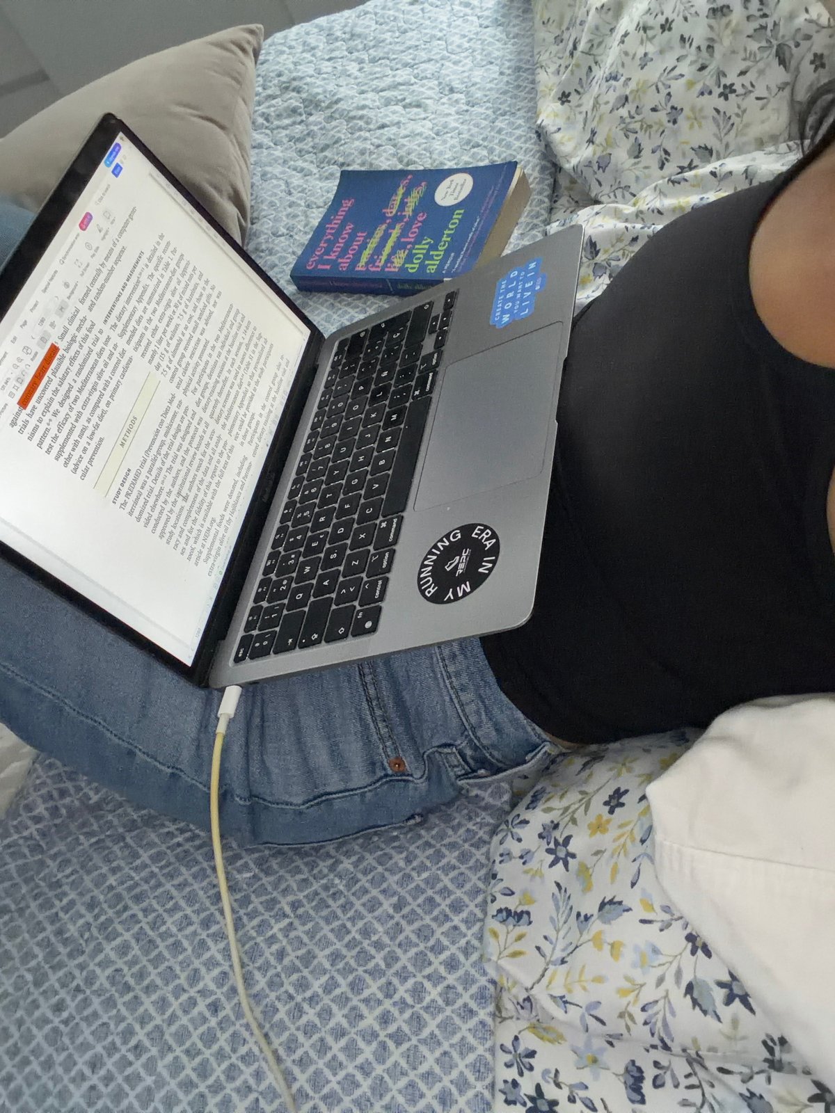 Laptop and book evening on a patterned bed in Mexico