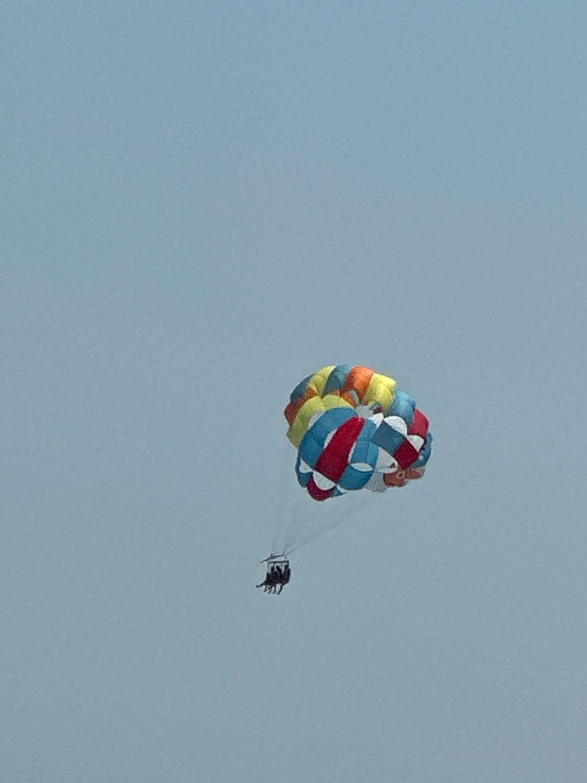 Parasailing over calm Adriatic waters off Boreti, Montenegro