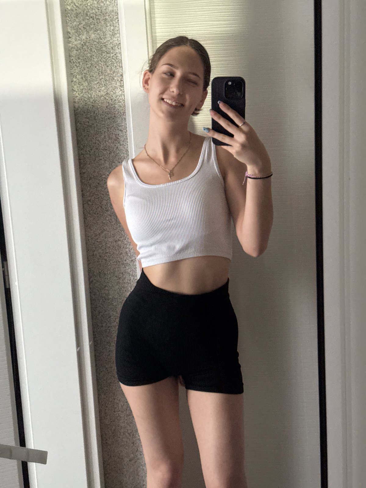 Young woman takes multiple selfies in Sofia apartment