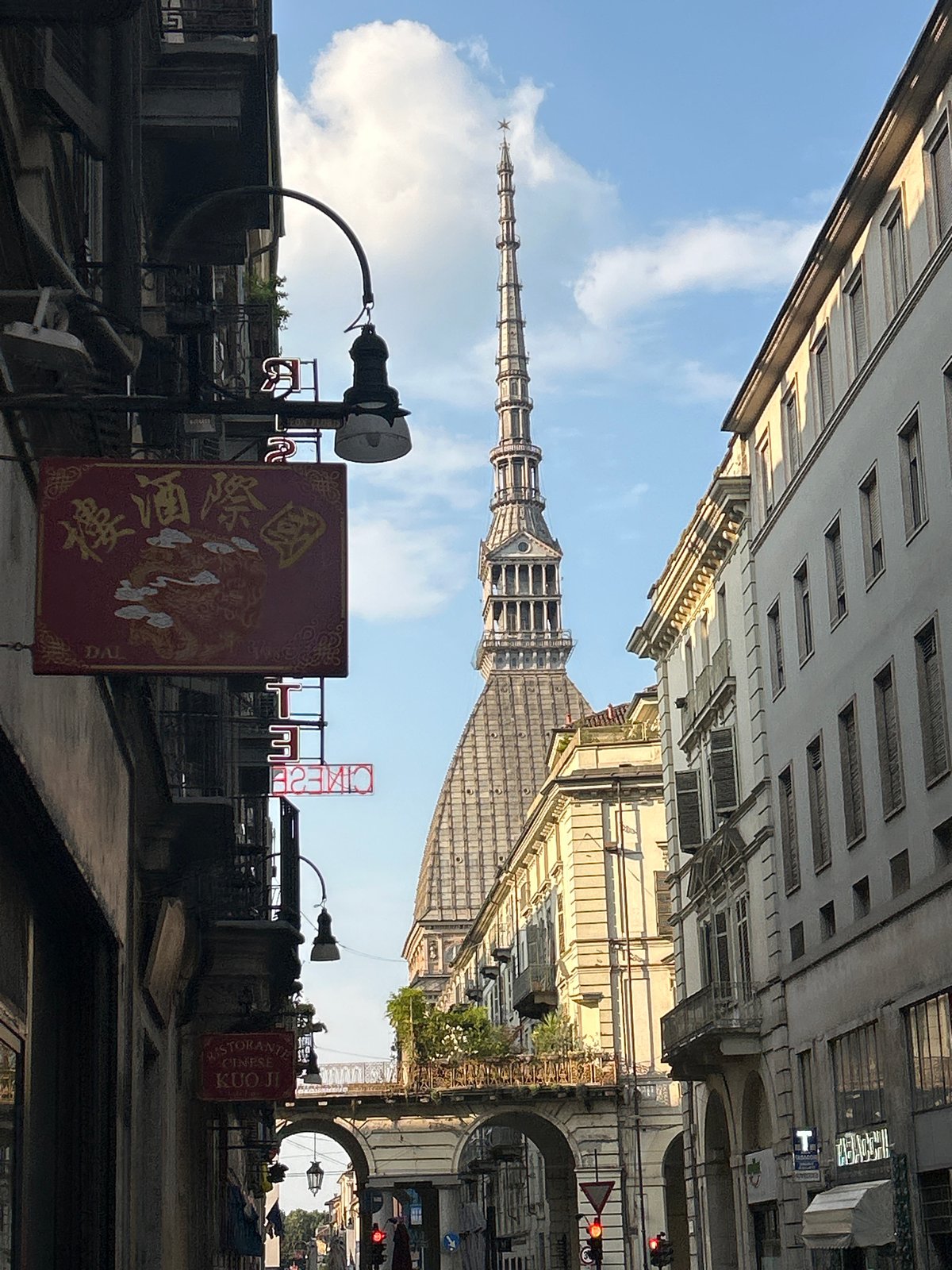 Looking up at Turin's Mole Antonelliana on a clear afternoon