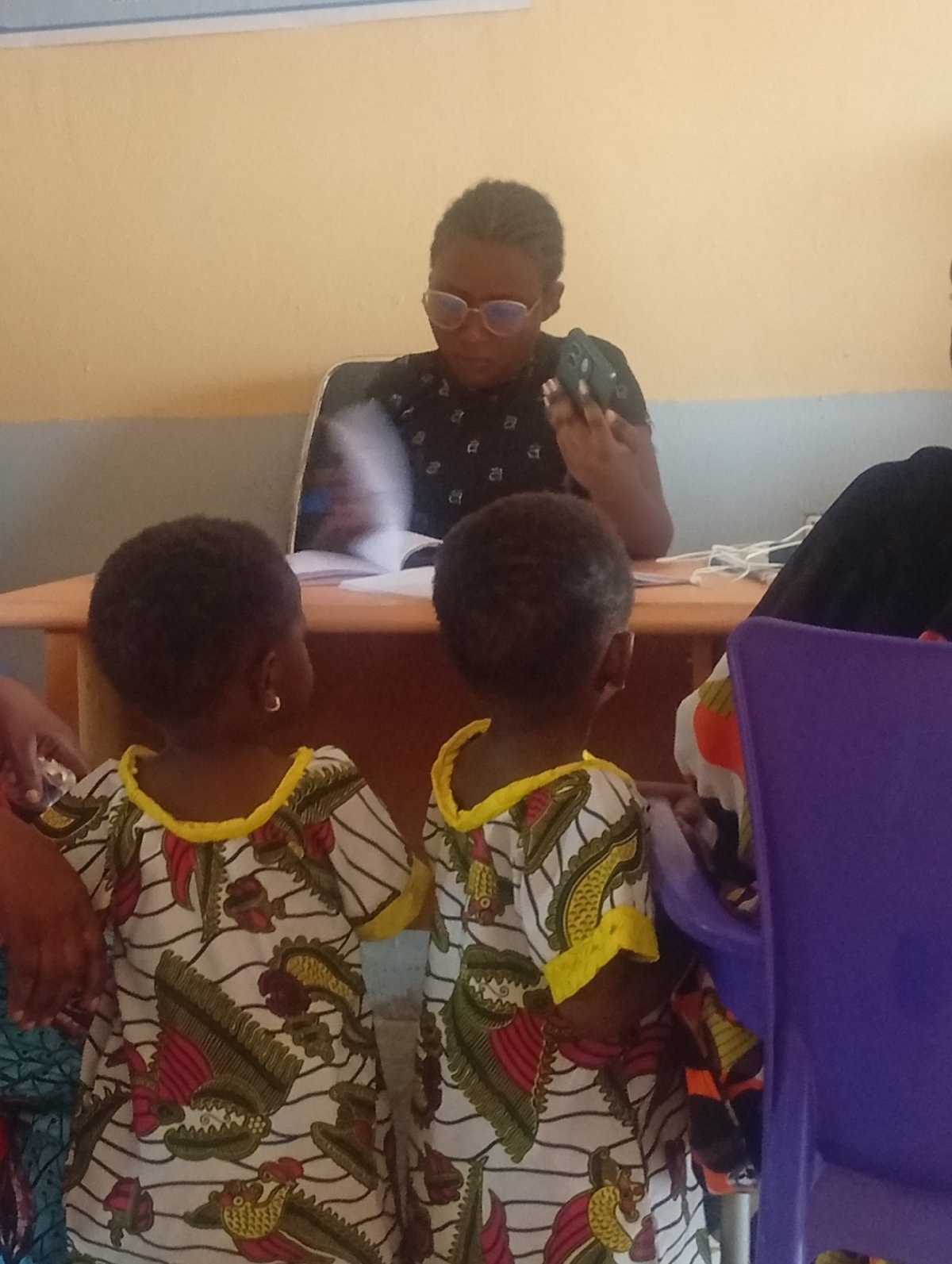 Young children spotted at office reception desk
