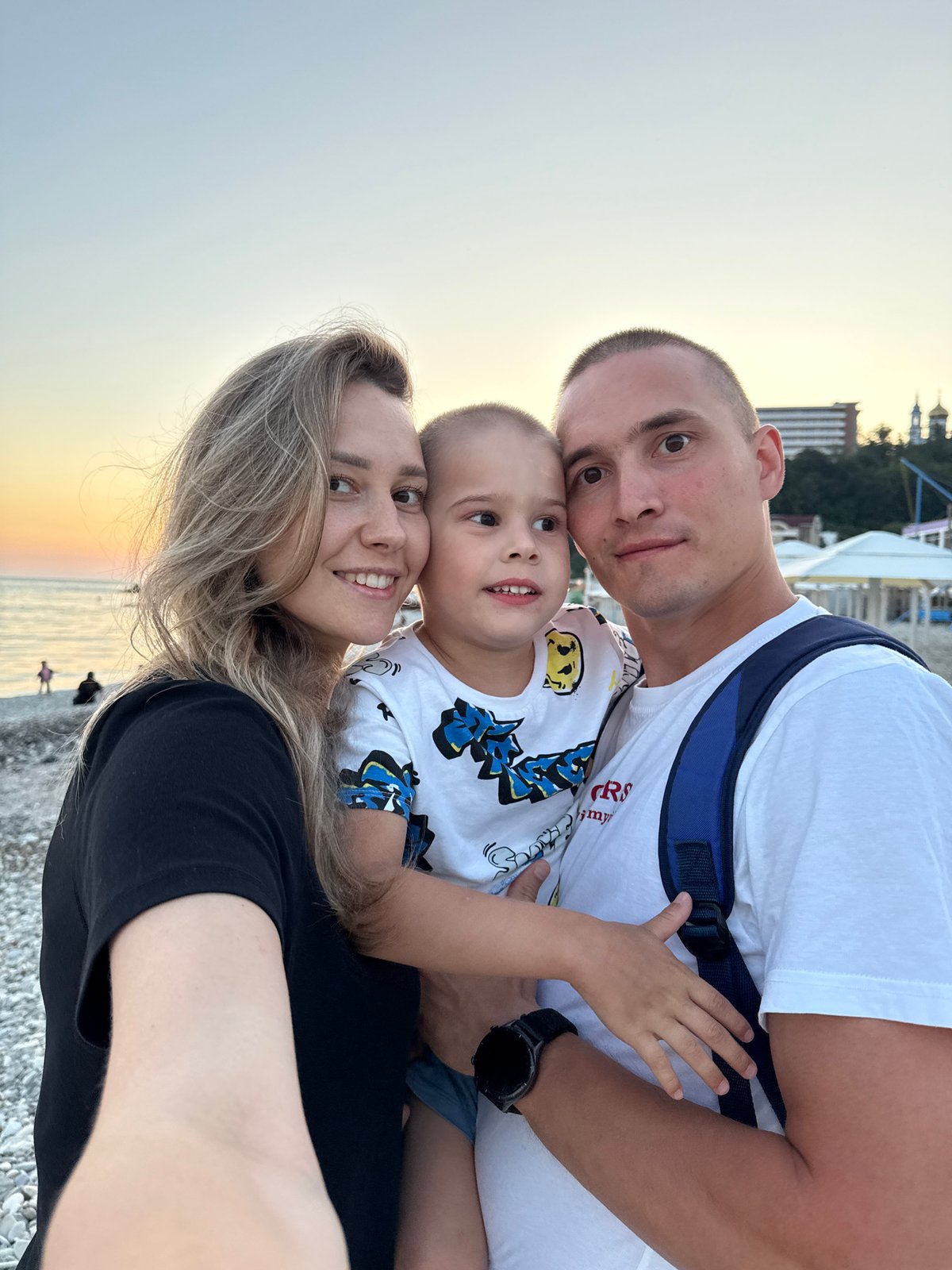 Family documents sunset beach vacation in Nebug, Russia