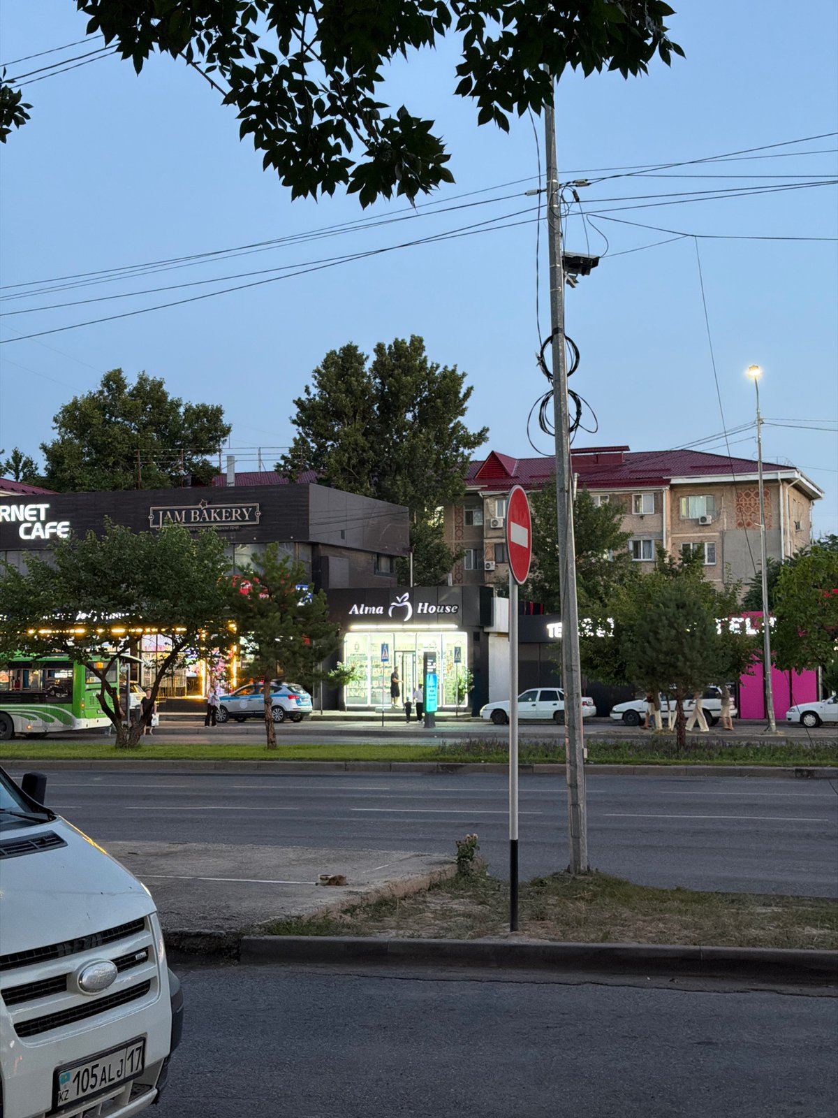 Everyday street life across Shymkent's commercial and residential areas