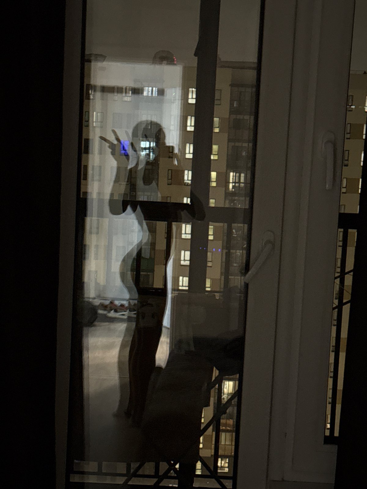 Nighttime window reflections captured in Lyubertsy, Russia
