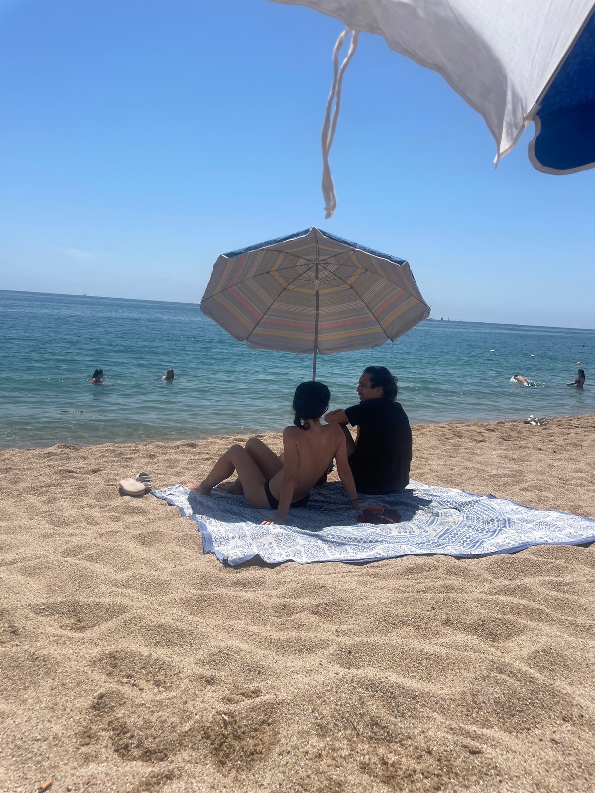 Families enjoy sunny Sunday morning at Arenys de Mar beach
