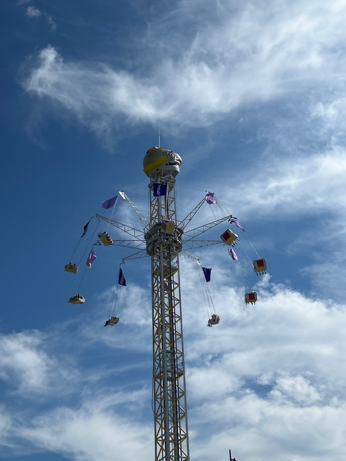 Moscow amusement park rides running on a clear summer afternoon
