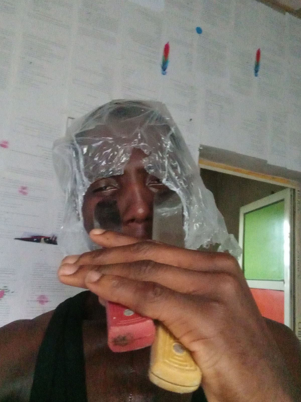 Person documents phone unboxing and daily activities in Akwete