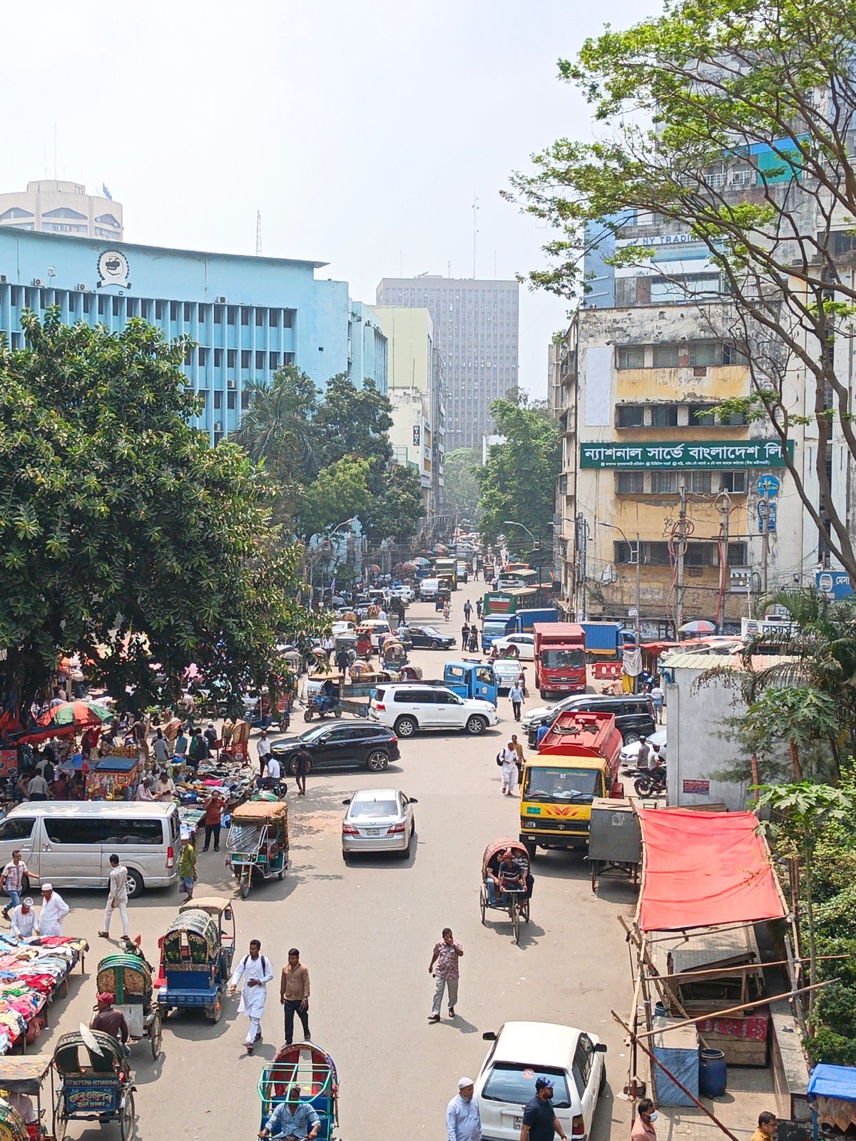 Morning street market activity documented across central Dhaka