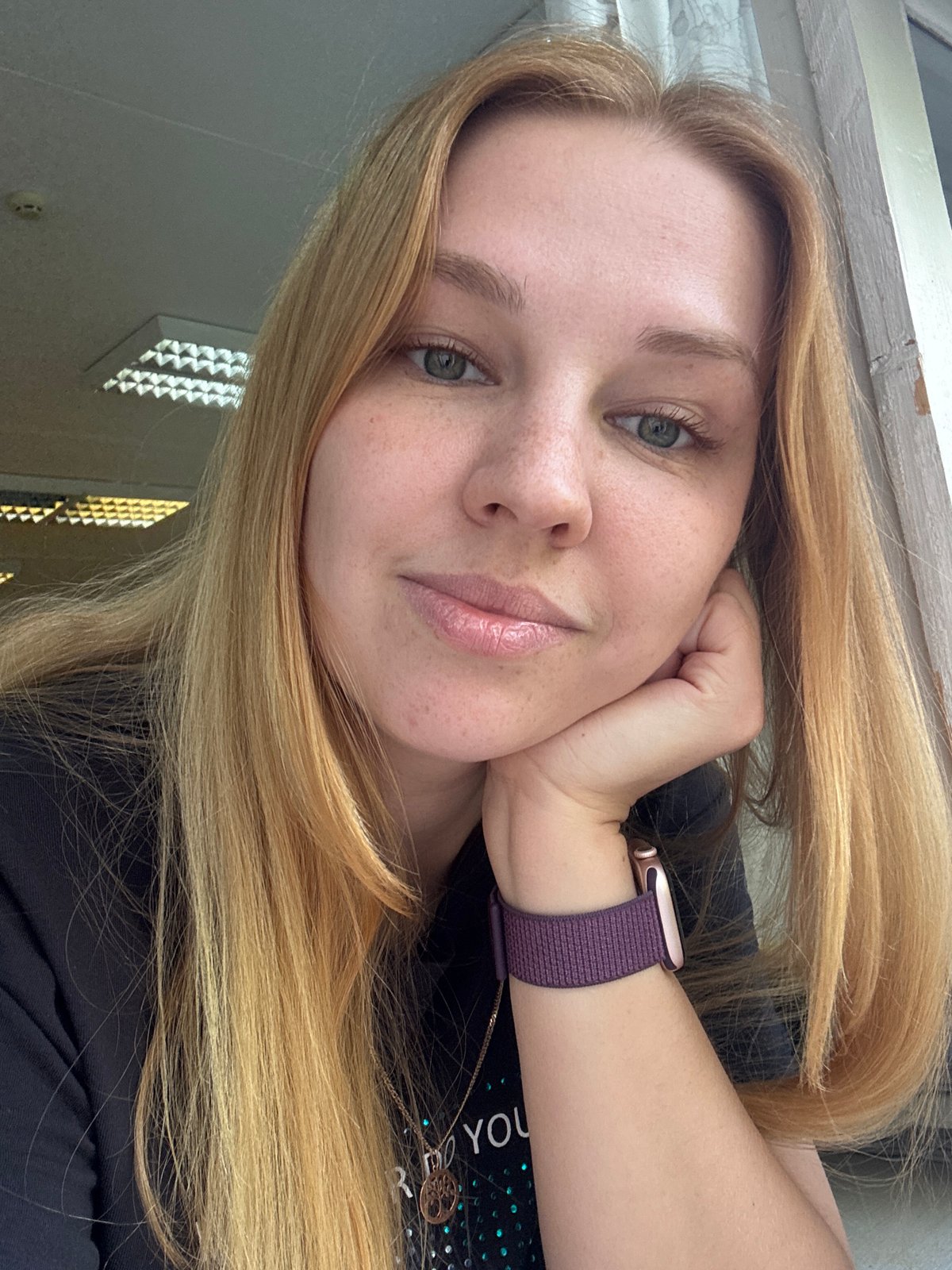 Woman takes selfie under cloudy skies in Rusanovo