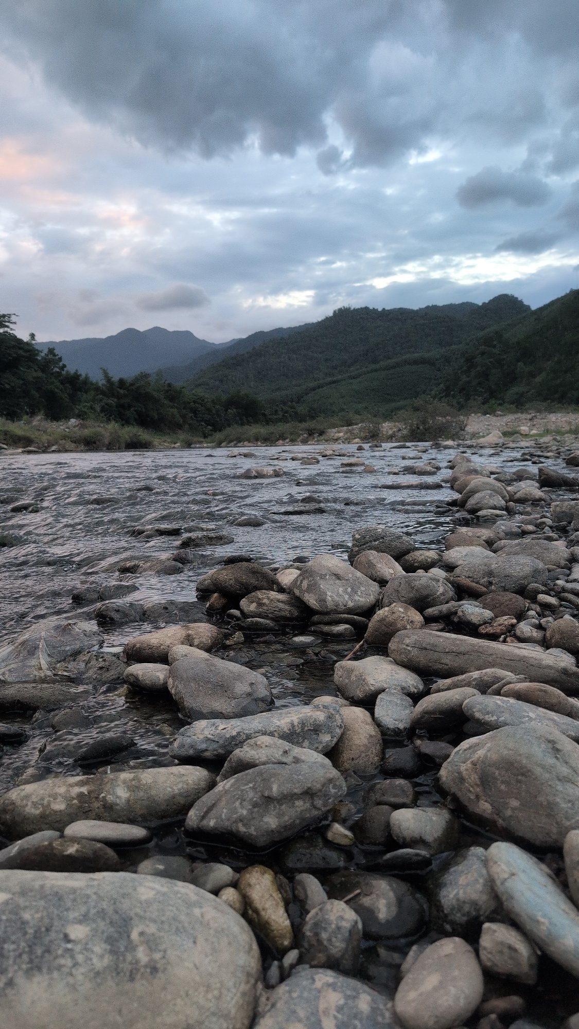 Riverside stones and a quiet porch in Huế