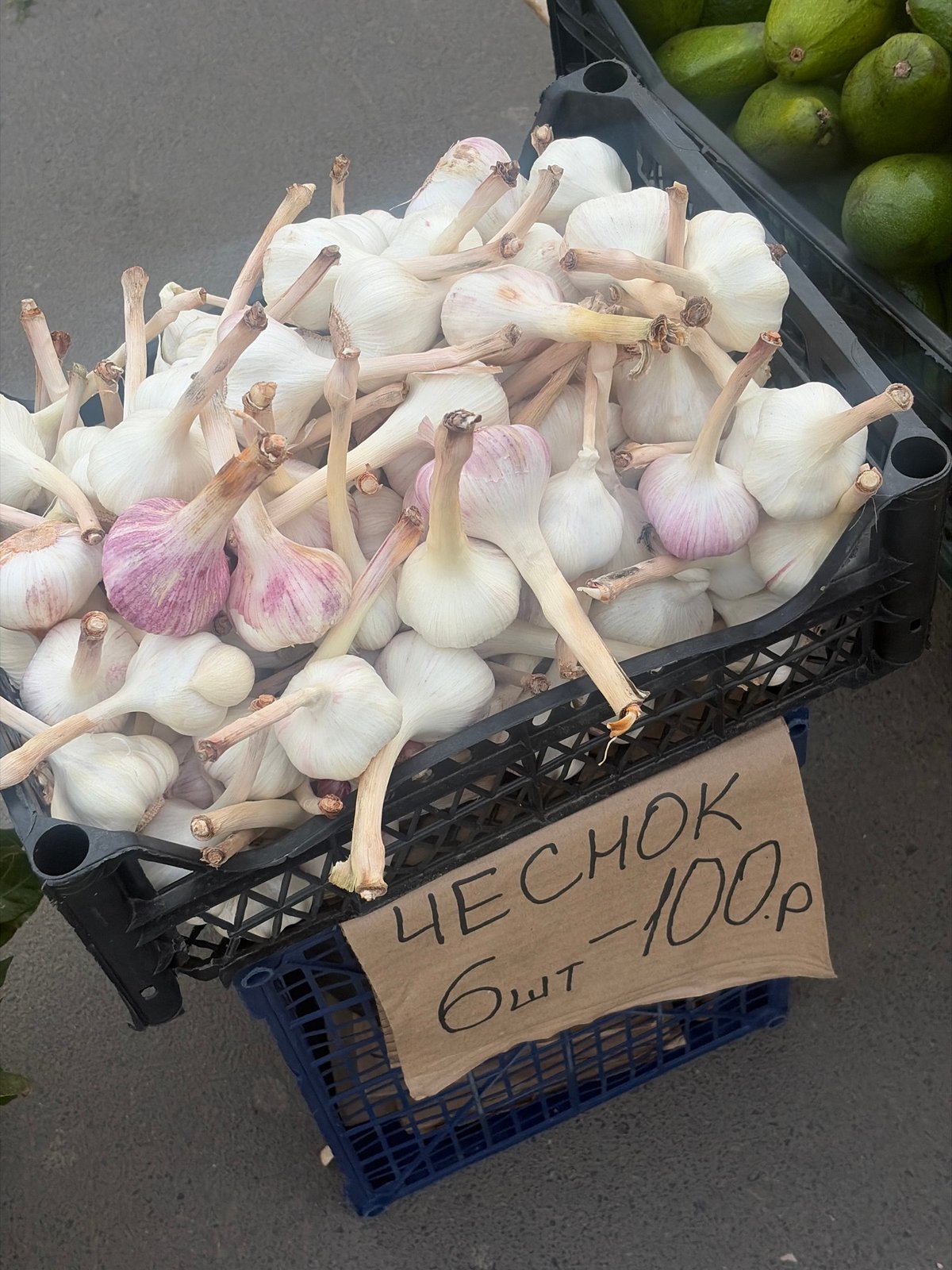 Vendor stalls display produce, balloons at Saint Petersburg market