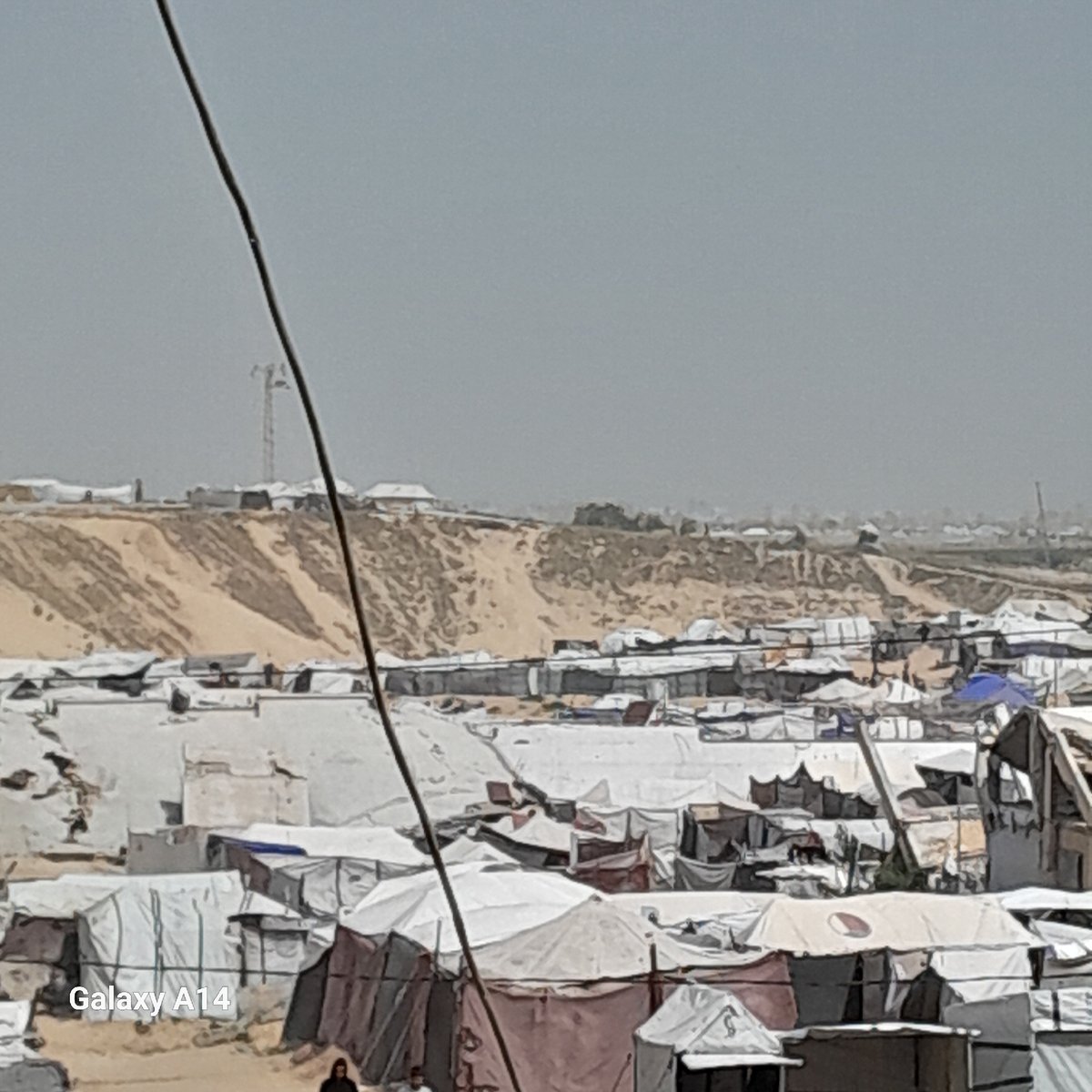 Displacement camp documented in Khan Yunis under overcast skies