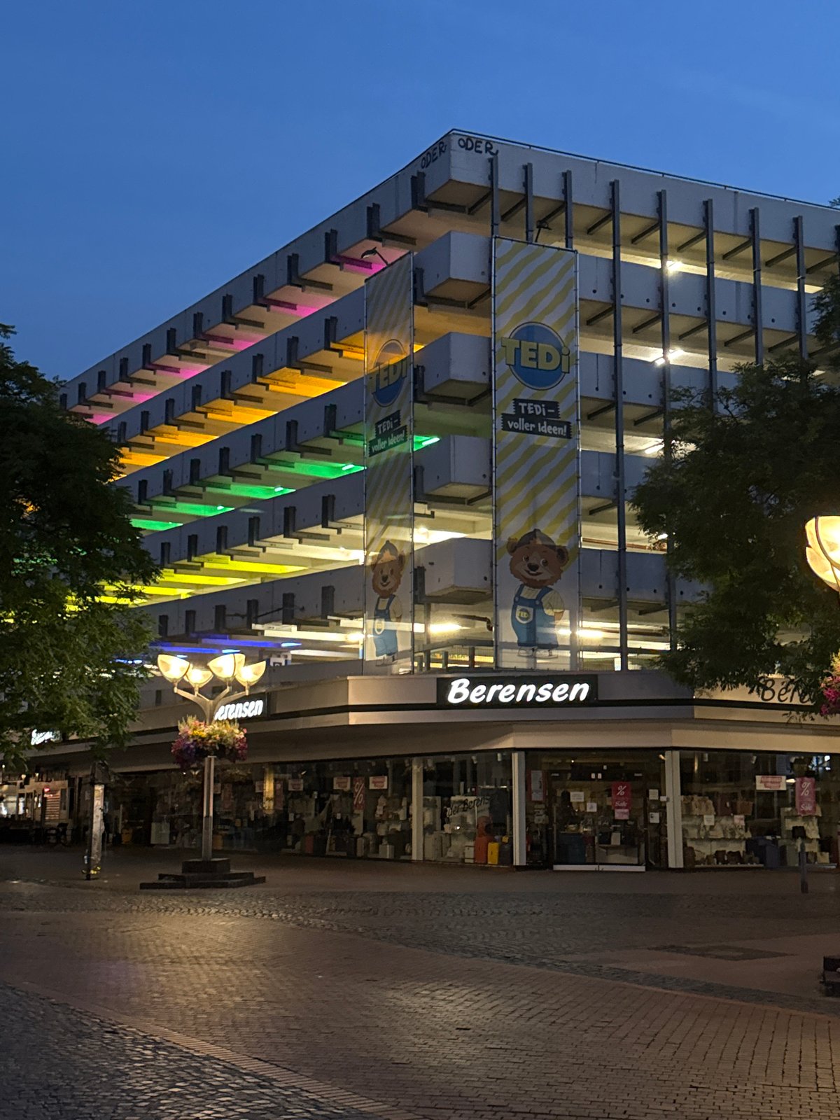 Duisburg streetscape at dusk, colorful garage and office building