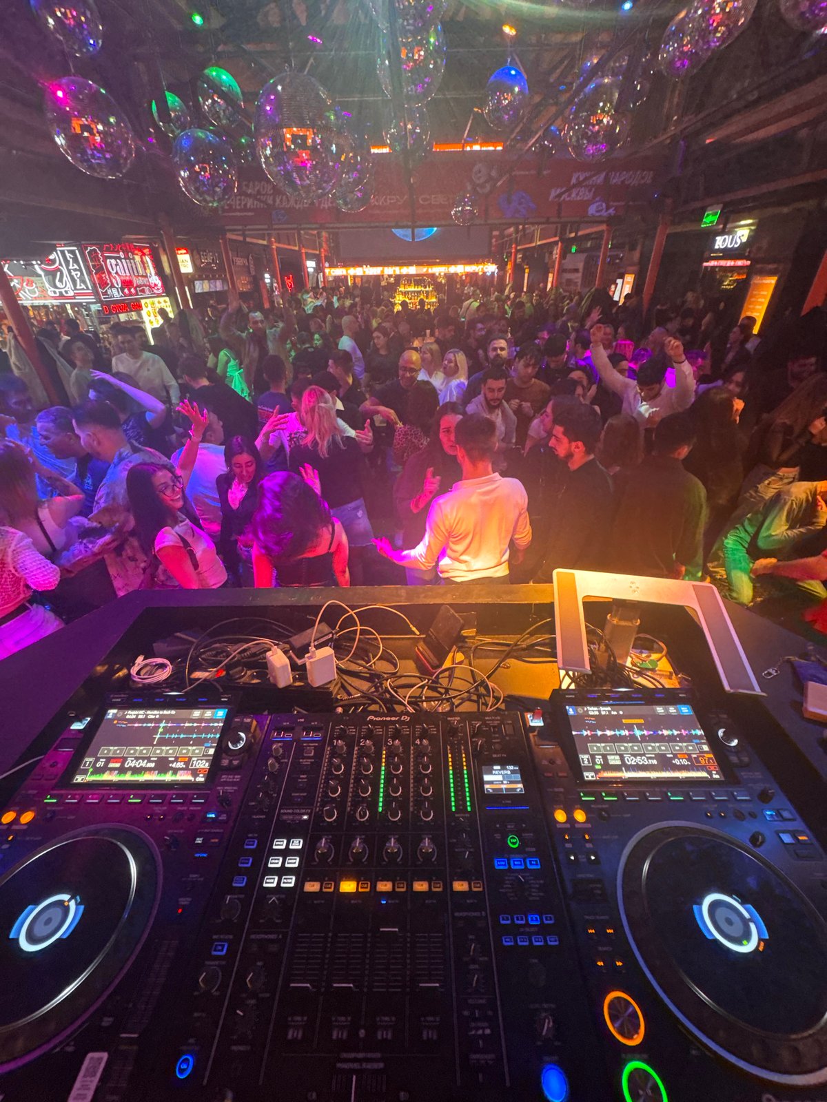 Moscow nightclub captured from DJ booth perspective