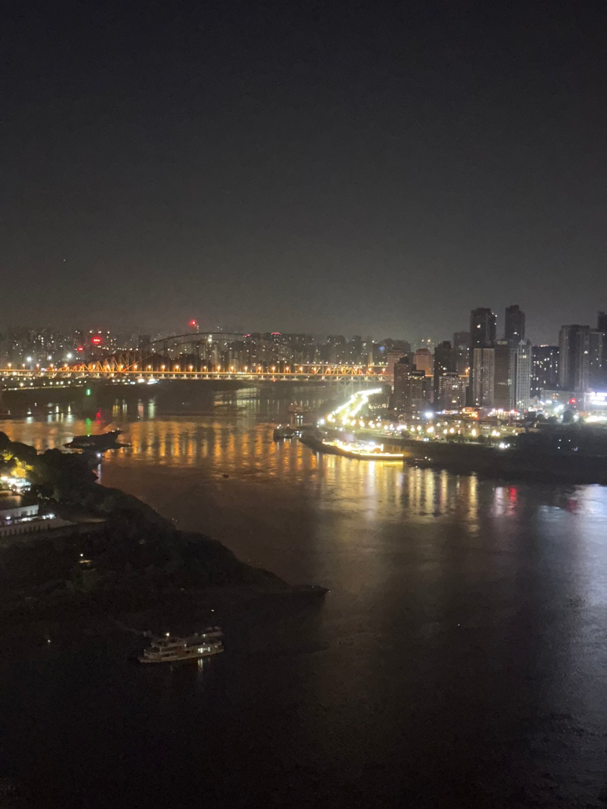 Yuzhong District at night, skyline and streets below