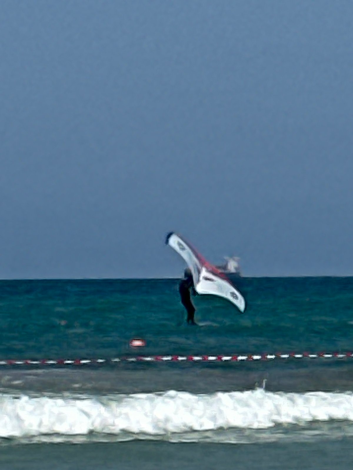 Wing foiling off Kiryat Yam on a calm summer morning