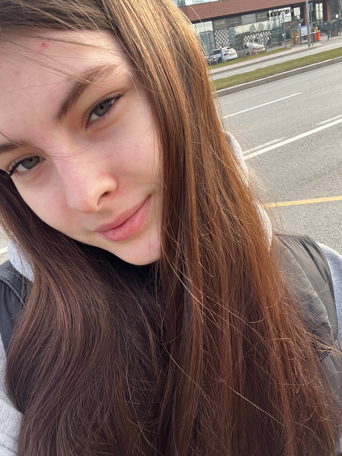 Woman takes morning selfies on Saint Petersburg street