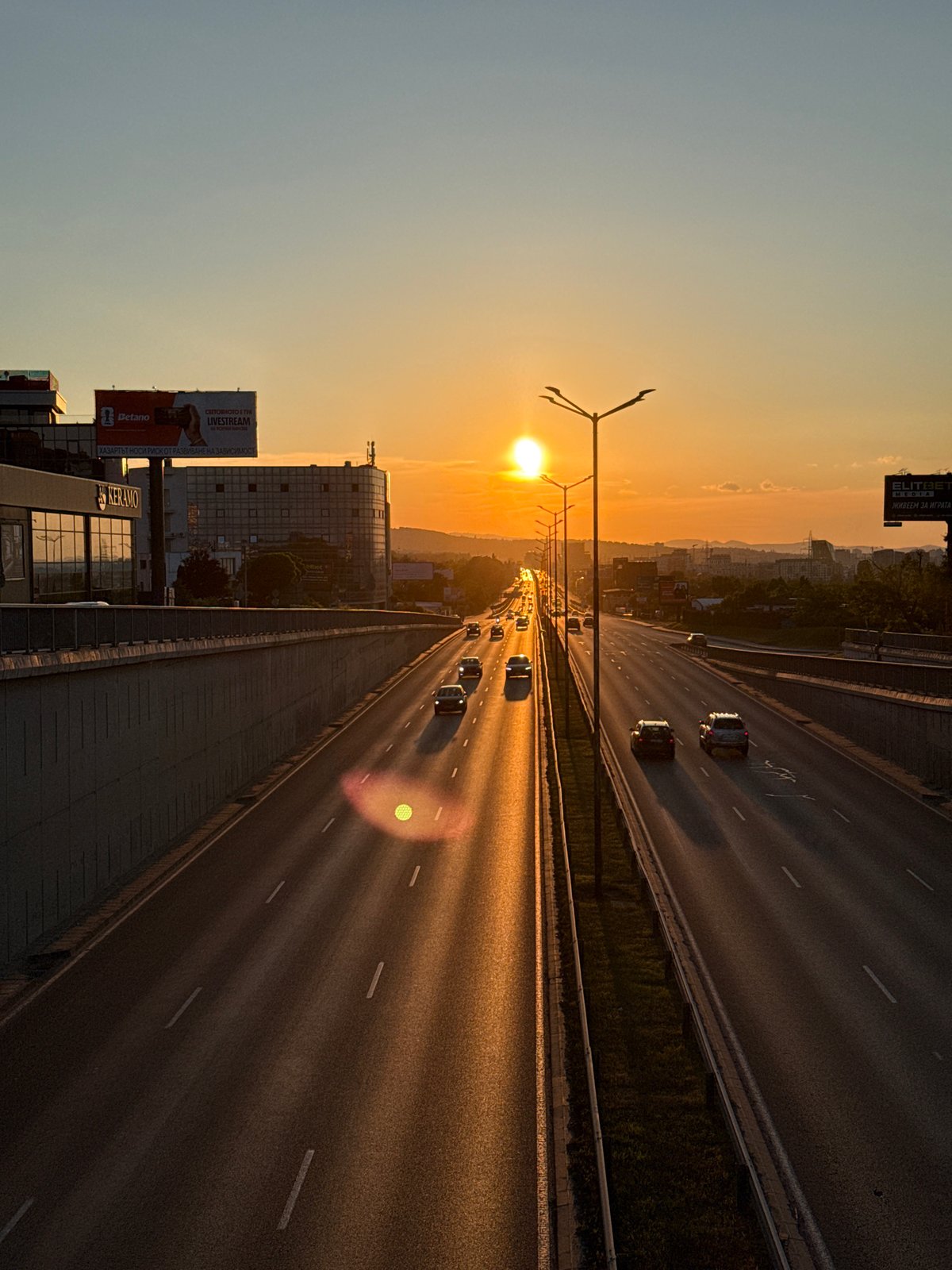 Evening rush hour traffic captured during golden sunset in Sofia