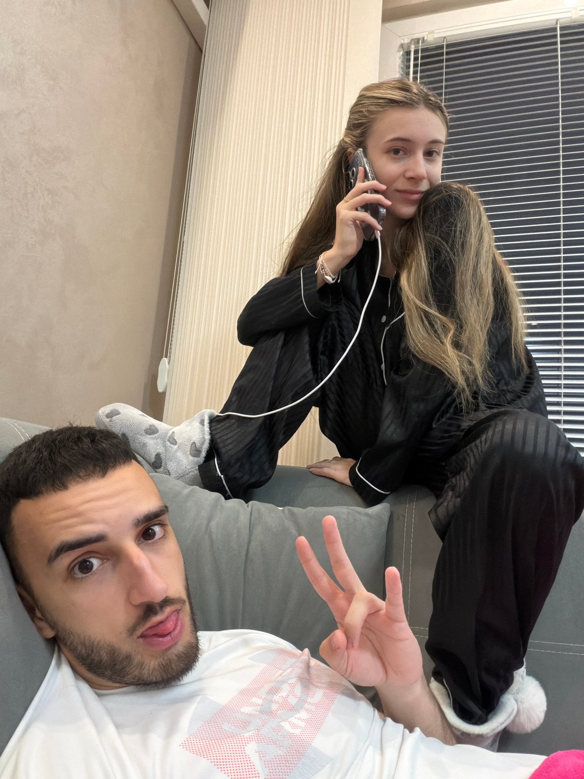 Two people relax on couch in Plovdiv home