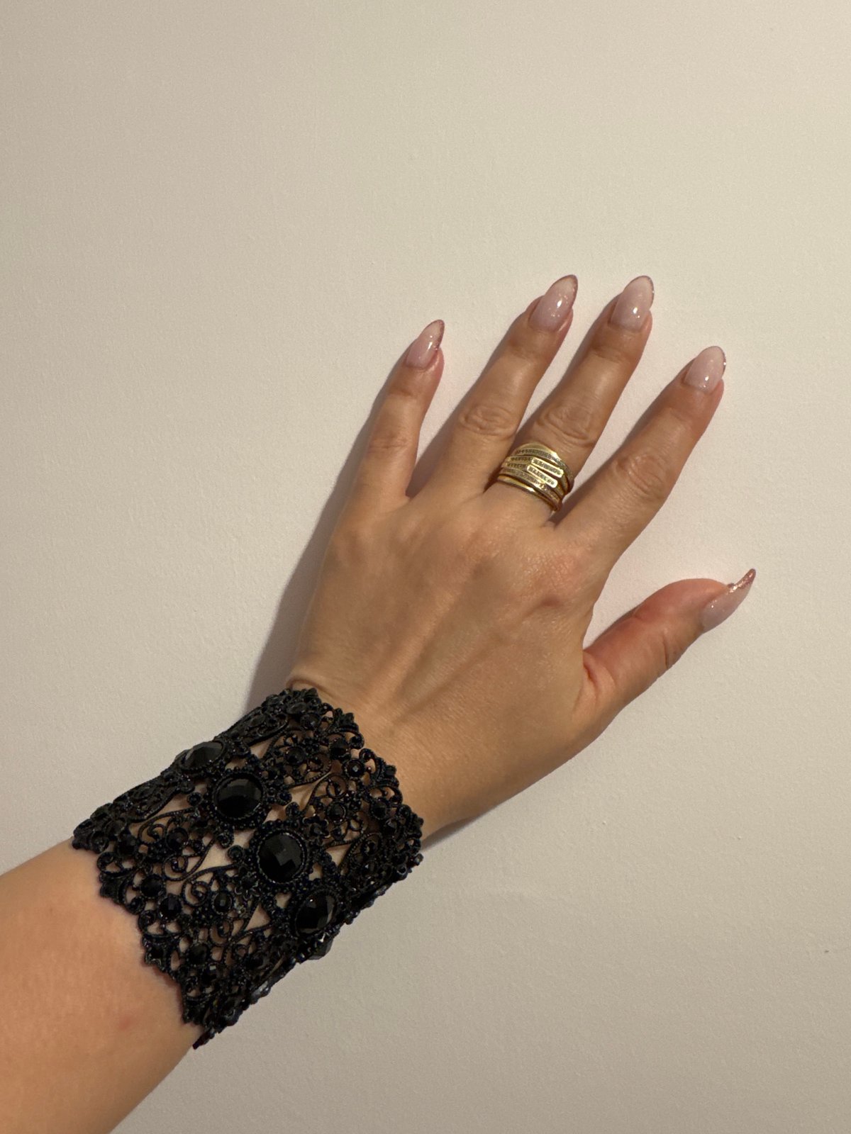 Intimate evening details: hands, bracelets, and a TV in Burgas