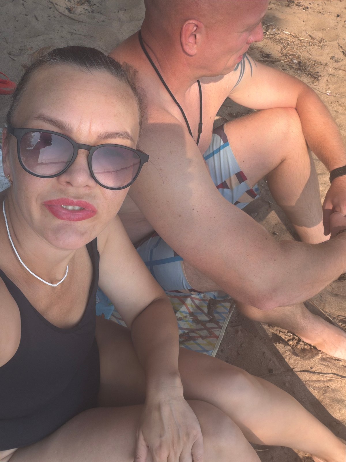 Lazy summer river beach day with food, a dog, and wading.