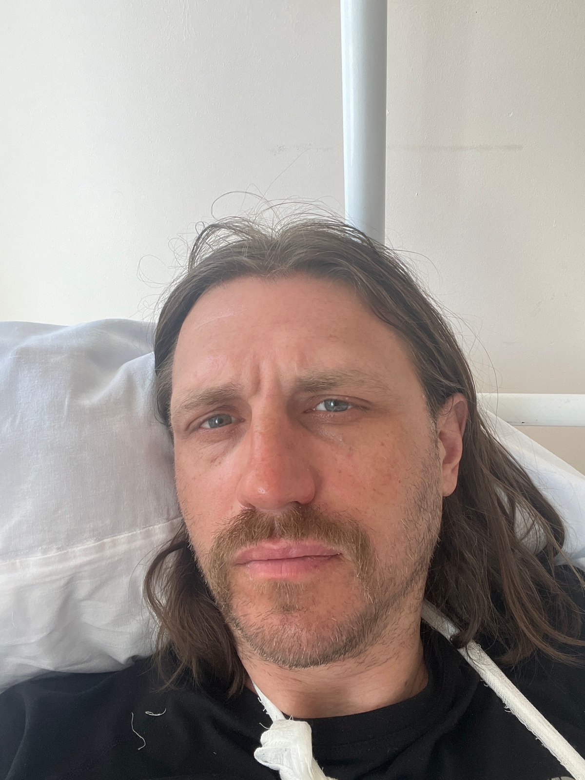 Man rests in medical facility during early morning hours