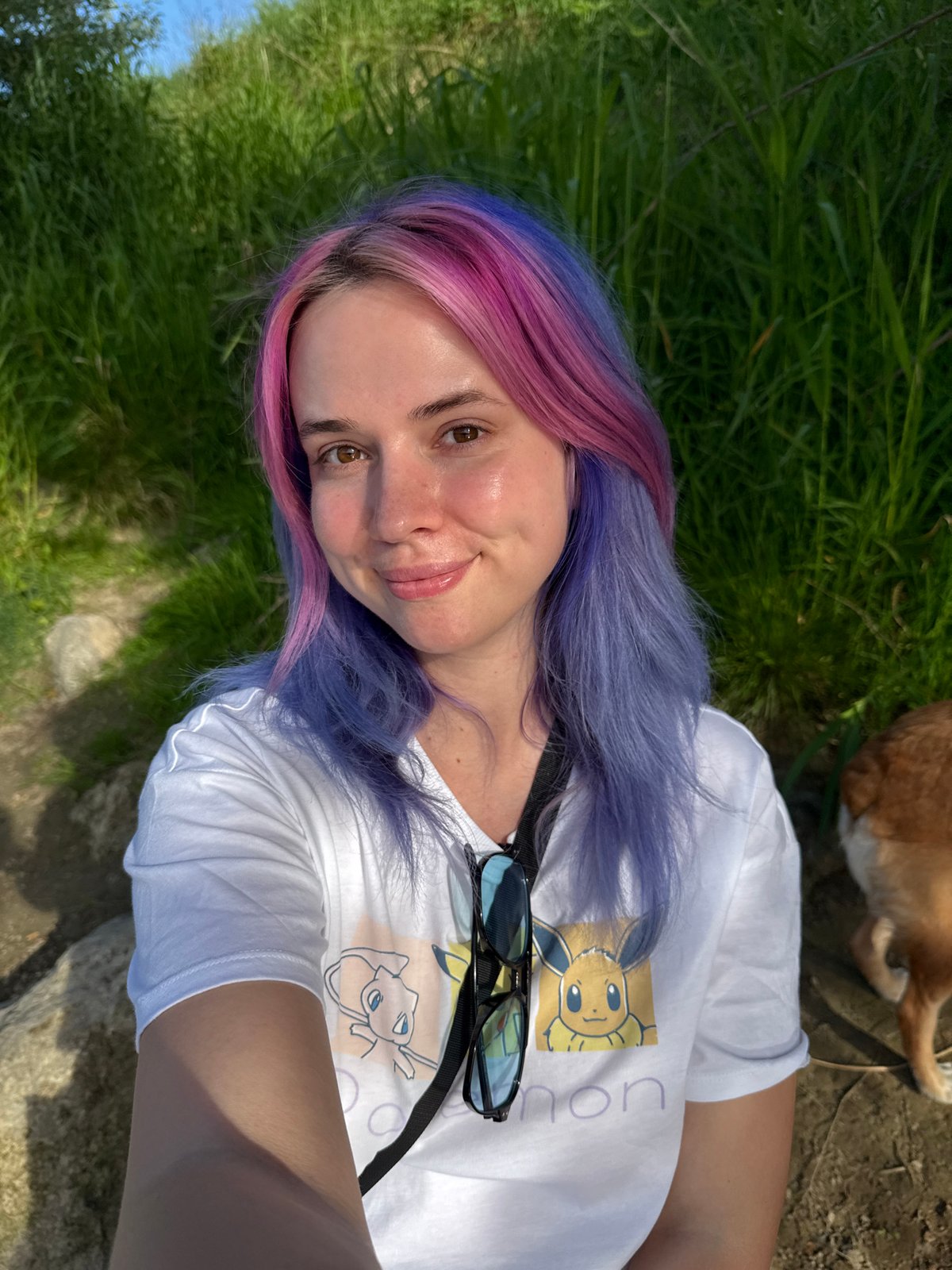 Person with colorful hair enjoys afternoon with dog in Zagreb