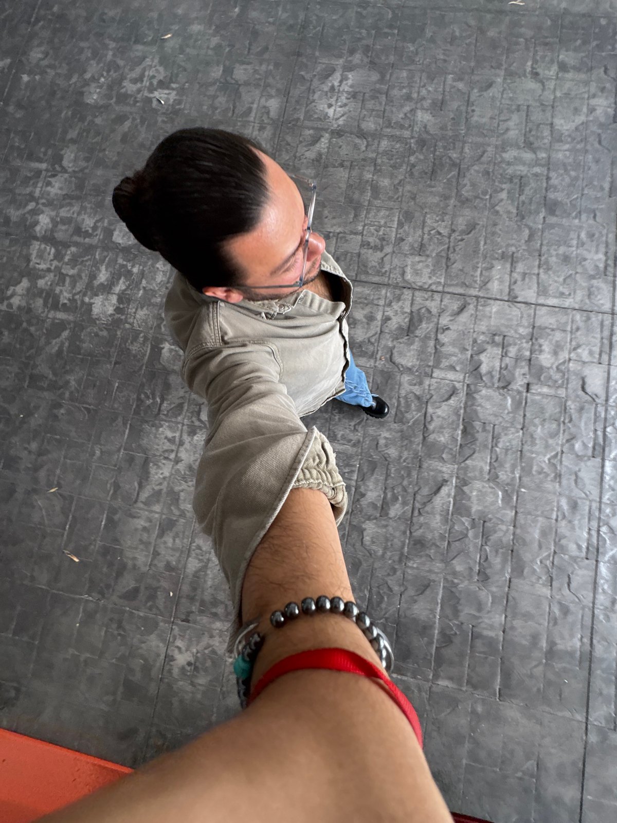 Person documented moving through modern building interior in Puebla